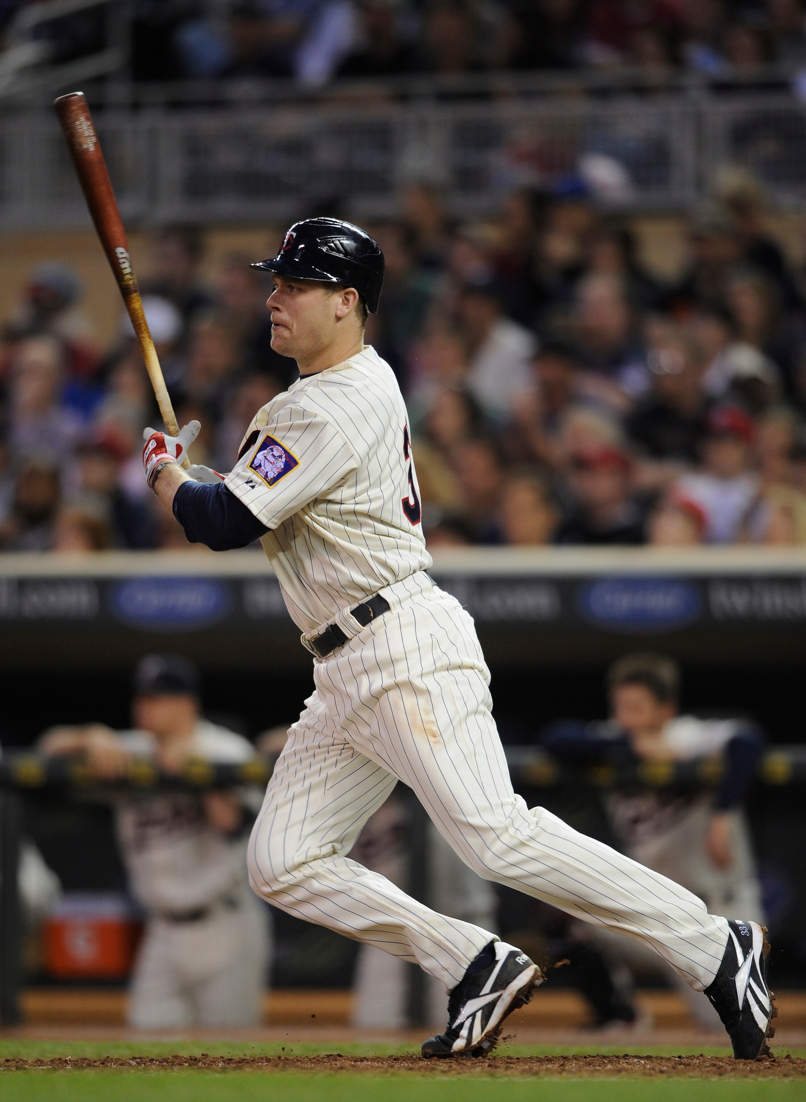 MINNEAPOLIS, MN - MAY 28: Justin Morneau #33 of the Minnesota Twins singles against the Los Angeles Angels of Anaheim during the tenth inning of their game on May 28, 2011 at Target Field in Minneapolis, Minnesota. Twins defeated the Angels in ten innings