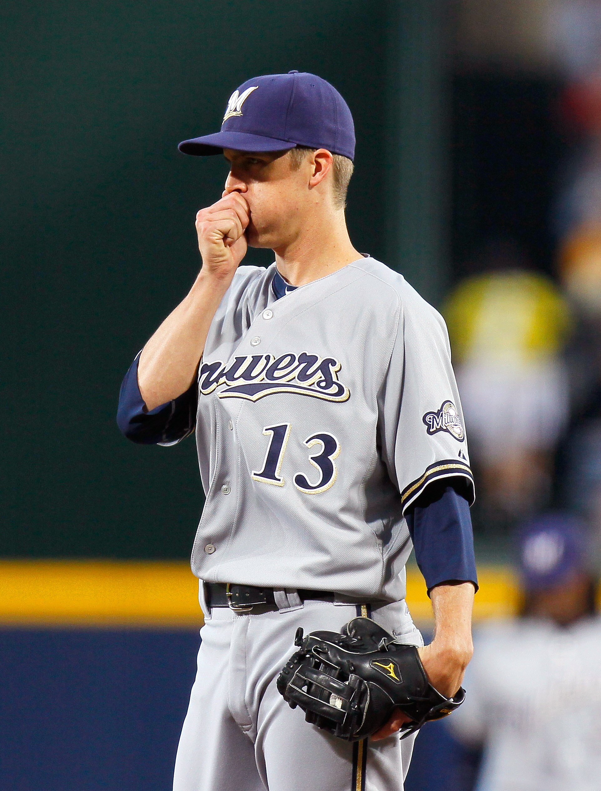 ATLANTA, GA - MAY 04:  Zack Greinke #13 of the Milwaukee Brewers tries to warm up his right hand in the first inning against the Atlanta Braves at Turner Field on May 4, 2011 in Atlanta, Georgia.  (Photo by Kevin C. Cox/Getty Images)