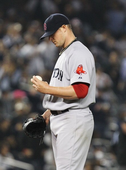 NEW YORK, NY - MAY 15:  Jon Lester #31 of the Boston Red Sox reacts after giving up a two run home run to Curtis Granderson #14 of the New York Yankees during their game on May 15, 2011 at Yankee Stadium in the Bronx borough of New York City.  (Photo by A
