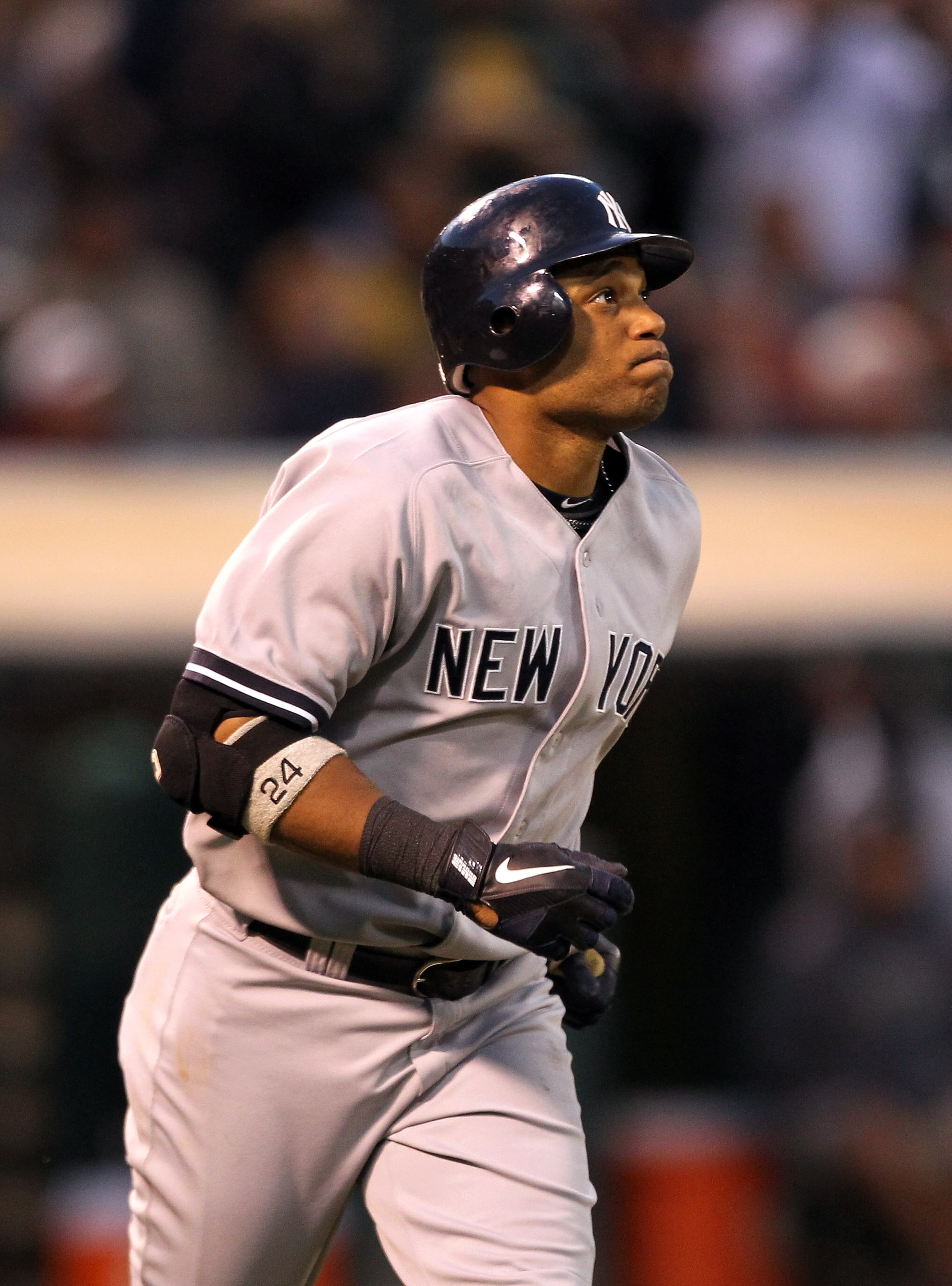 OAKLAND, CA - MAY 31:  Robinson Cano #24 of the New York Yankees watches his two run home run go over the wall in the fifth inning against the Oakland Athletics at Oakland-Alameda County Coliseum on May 31, 2011 in Oakland, California.  (Photo by Ezra Sha