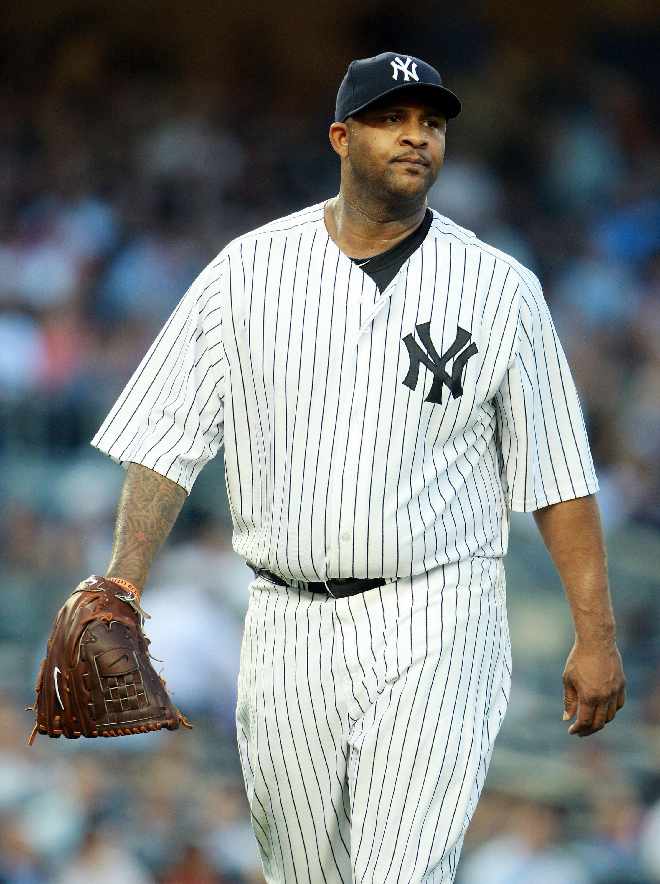 NEW YORK, NY - MAY 24:  CC Sabathia #52 of the New York Yankees walks off of the field at the end of an inning against the Toronto Blue Jays at Yankee Stadium on May 24, 2011 in the Bronx borough of New York City.  (Photo by Michael Heiman/Getty Images)