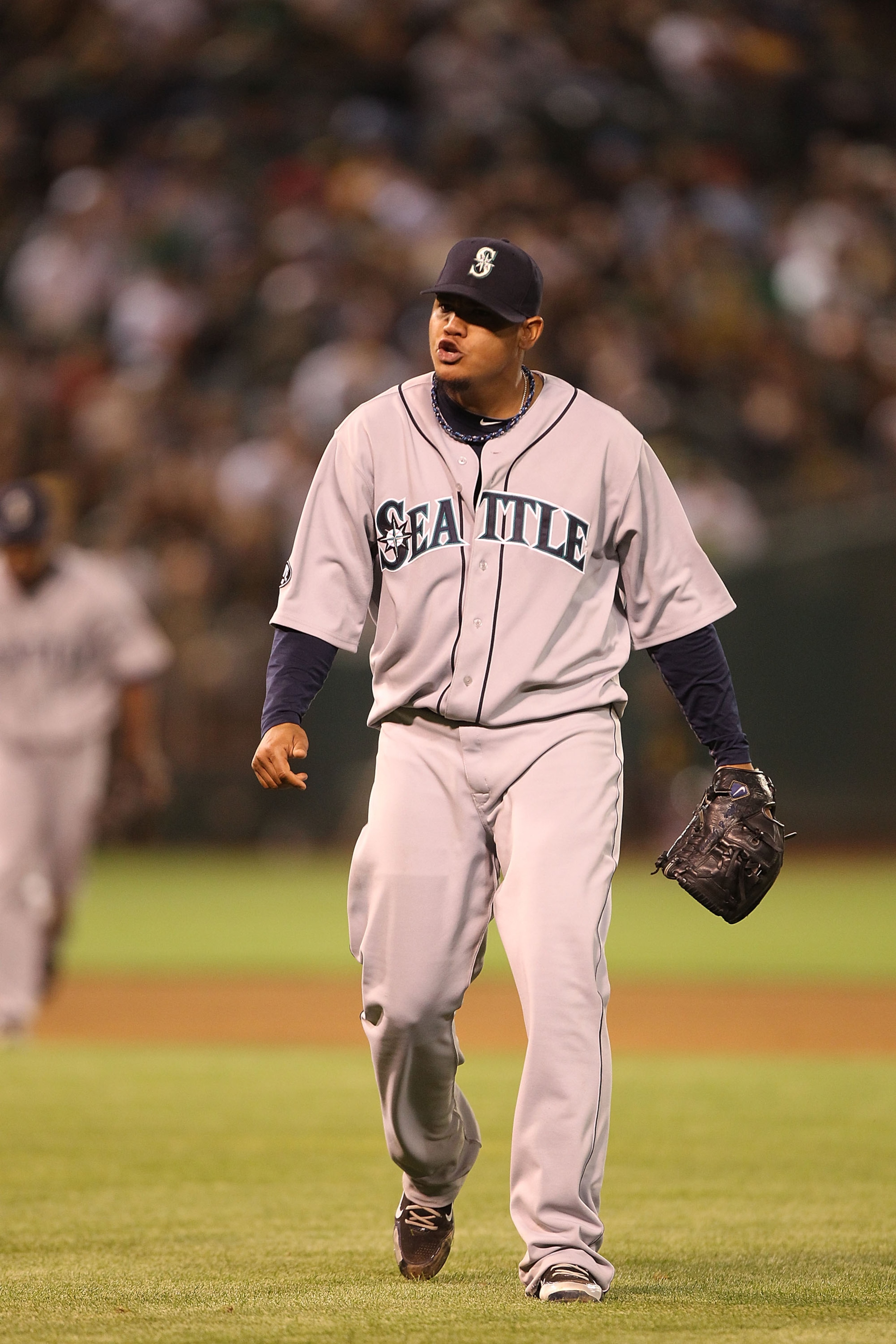 OAKLAND, CA - APRIL 01:  Felix Hernandez #34 of the Seattle Mariners celebrates at the end of the eighth inning against the Oakland Athletics during an opening day game of Major League Baseball at the Oakland-Alameda County Coliseum on April 1, 2011 in Oa