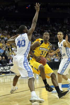 NEWARK, NJ - MARCH 25:  Jimmy Butler #33 of the Marquette Golden Eagles against Harrison Barnes #40 of the North Carolina Tar Heels during the east regional semifinal of the 2011 NCAA Men's Basketball Tournament at the Prudential Center on March 25, 2011 