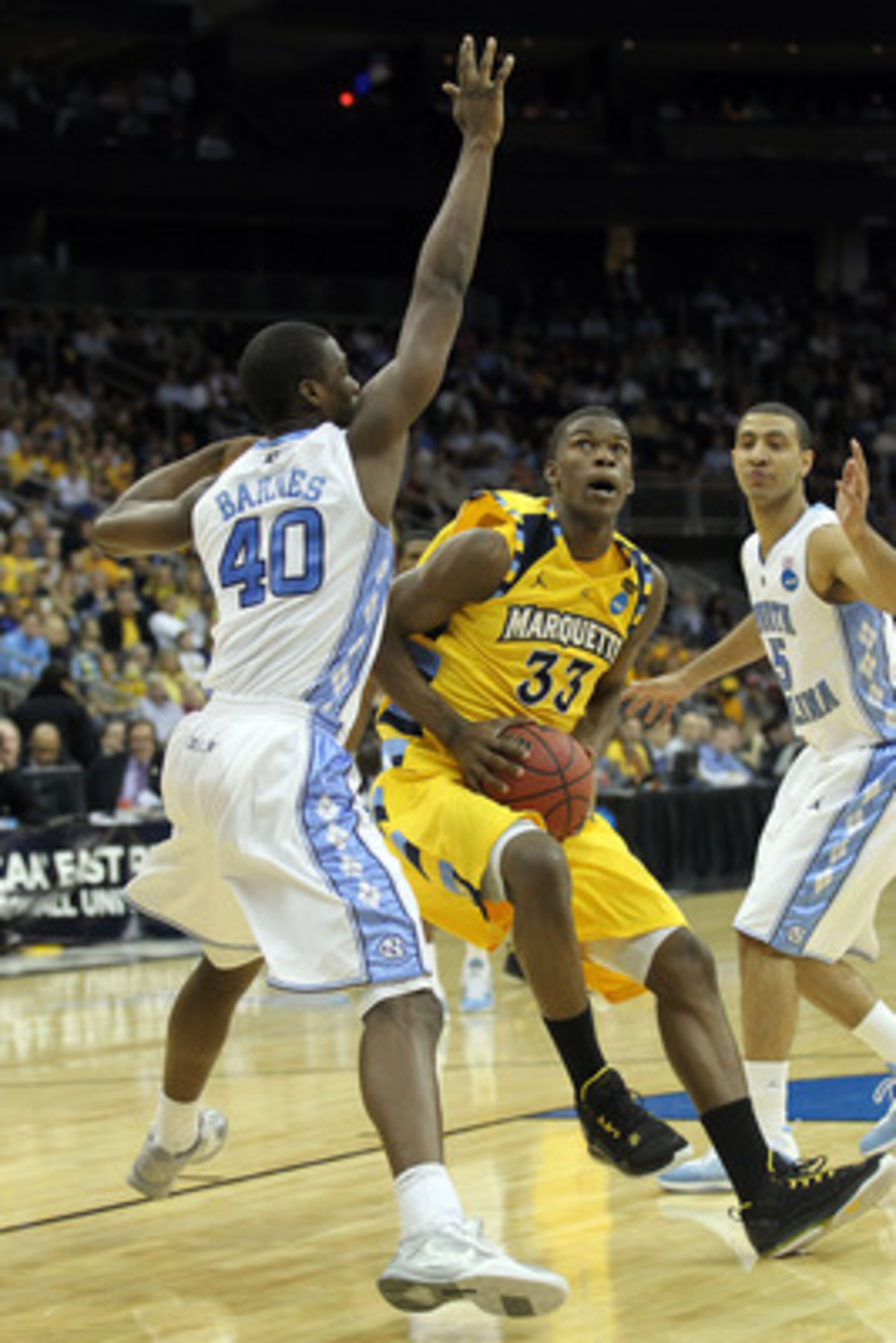 NEWARK, NJ - MARCH 25:  Jimmy Butler #33 of the Marquette Golden Eagles against Harrison Barnes #40 of the North Carolina Tar Heels during the east regional semifinal of the 2011 NCAA Men's Basketball Tournament at the Prudential Center on March 25, 2011 
