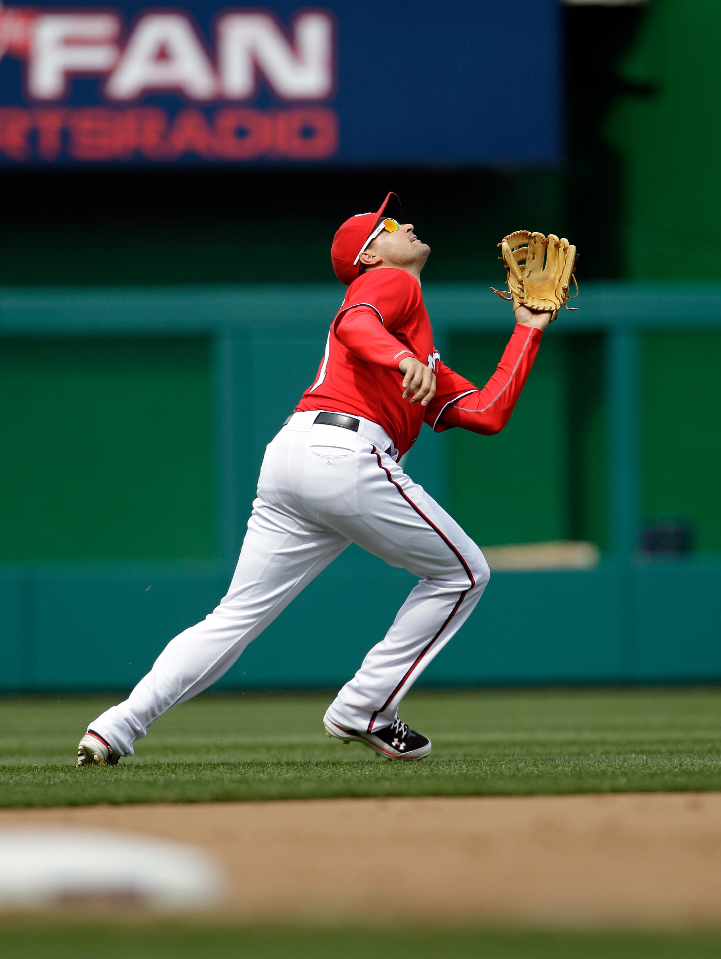 WASHINGTON, DC - APRIL 03: Third baseman Ryan Zimmerman #11 of the Washington Nationals waits for a pop up against the Atlanta Braves at Nationals Park on April 3, 2011 in Washington, DC.  (Photo by Rob Carr/Getty Images)