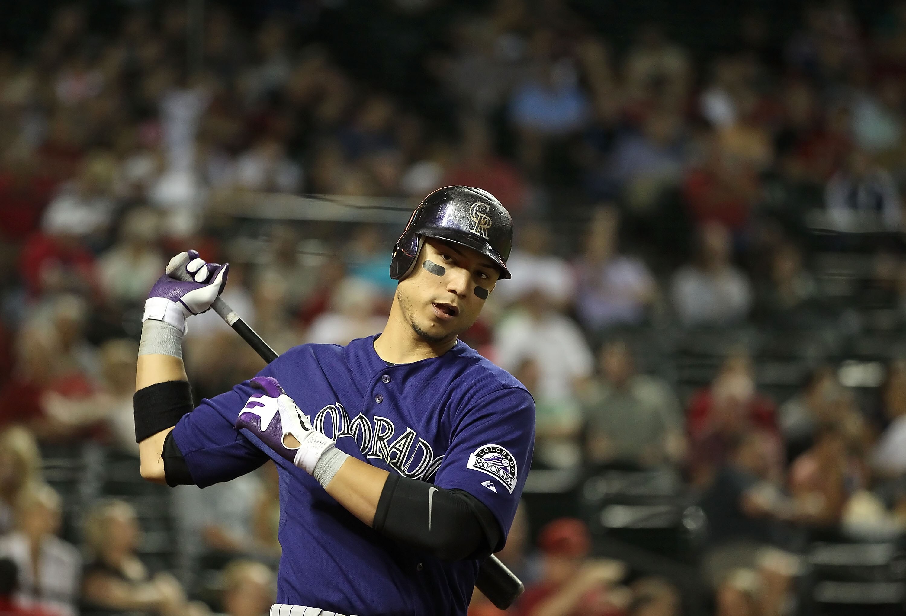PHOENIX, AZ - MAY 05:  Carlos Gonzalez #5 of the Colorado Rockies on deck during the Major League Baseball game against the Arizona Diamondbacks at Chase Field on May 5, 2011 in Phoenix, Arizona.  The Diamondbacks defeated the Rockies 3-2 in 11 innings.