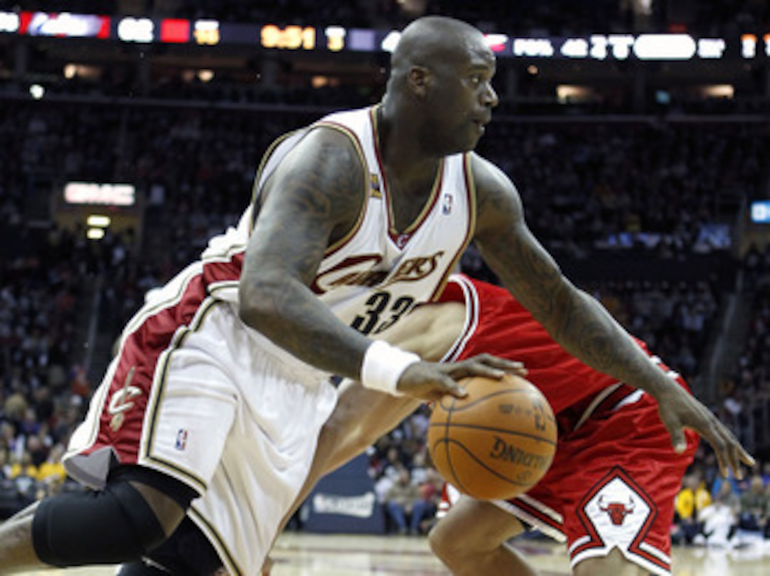 CLEVELAND - APRIL 17: Shaquille O'Neal #18 of the Cleveland Cavaliers makes a move around Joakim Noah #13 of the Chicago Bulls in Game One of the Eastern Conference Quarterfinals during the 2010 NBA Playoffs at Quicken Loans Arena on April 17, 2010 in Cl CLEVELAND - APRIL 17: Shaquille O'Neal #18 of the Cleveland Cavaliers makes a move around Joakim Noah #13 of the Chicago Bulls in Game One of the Eastern Conference Quarterfinals during the 2010 NBA Playoffs at Quicken Loans Arena on April 17, 2010 in Cl