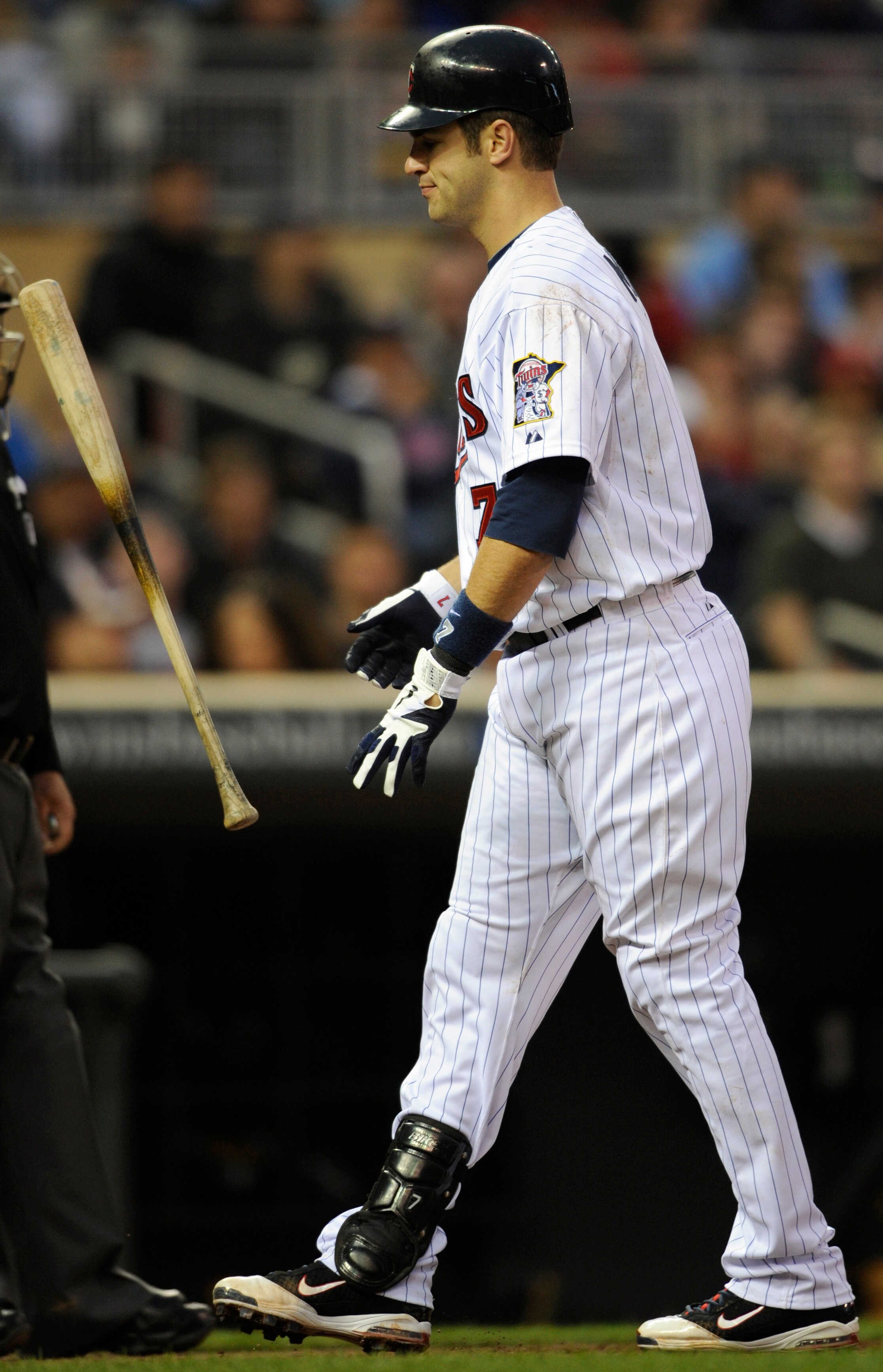 MINNEAPOLIS, MN - APRIL 9: Joe Mauer #7 of the Minnesota Twins reacts after a called strike three in the fifth inning against the Oakland Athletics on April 9, 2011 at Target Field in Minneapolis, Minnesota. Athletics defeated the Twins 1-0. (Photo by Han