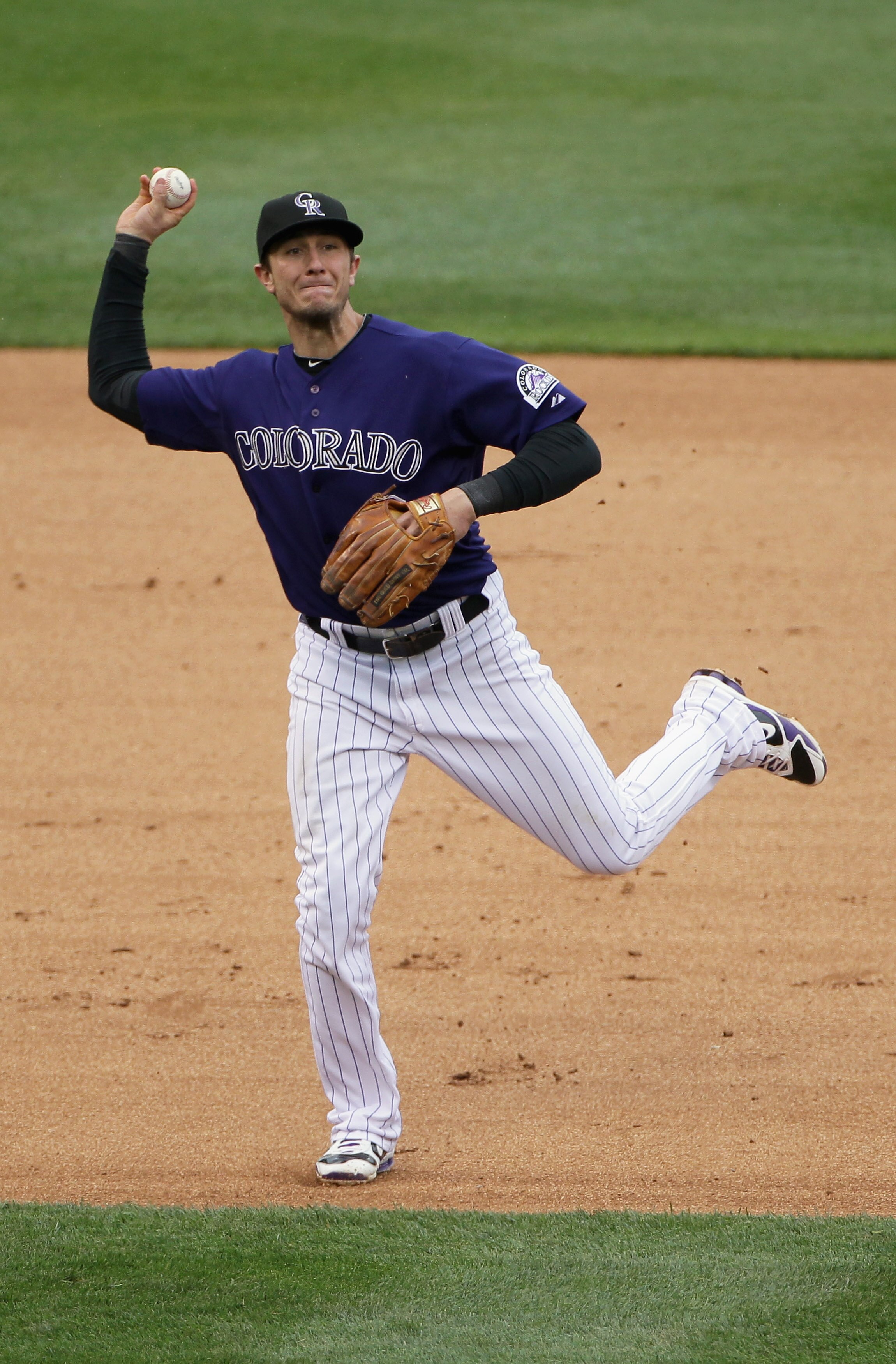 DENVER, CO - MAY 12:  Shortstop Troy Tulowitzki #2 of the Colorado Rockies throws out a runner against the New York Mets at Coors Field on May 12, 2011 in Denver, Colorado.  (Photo by Doug Pensinger/Getty Images)
