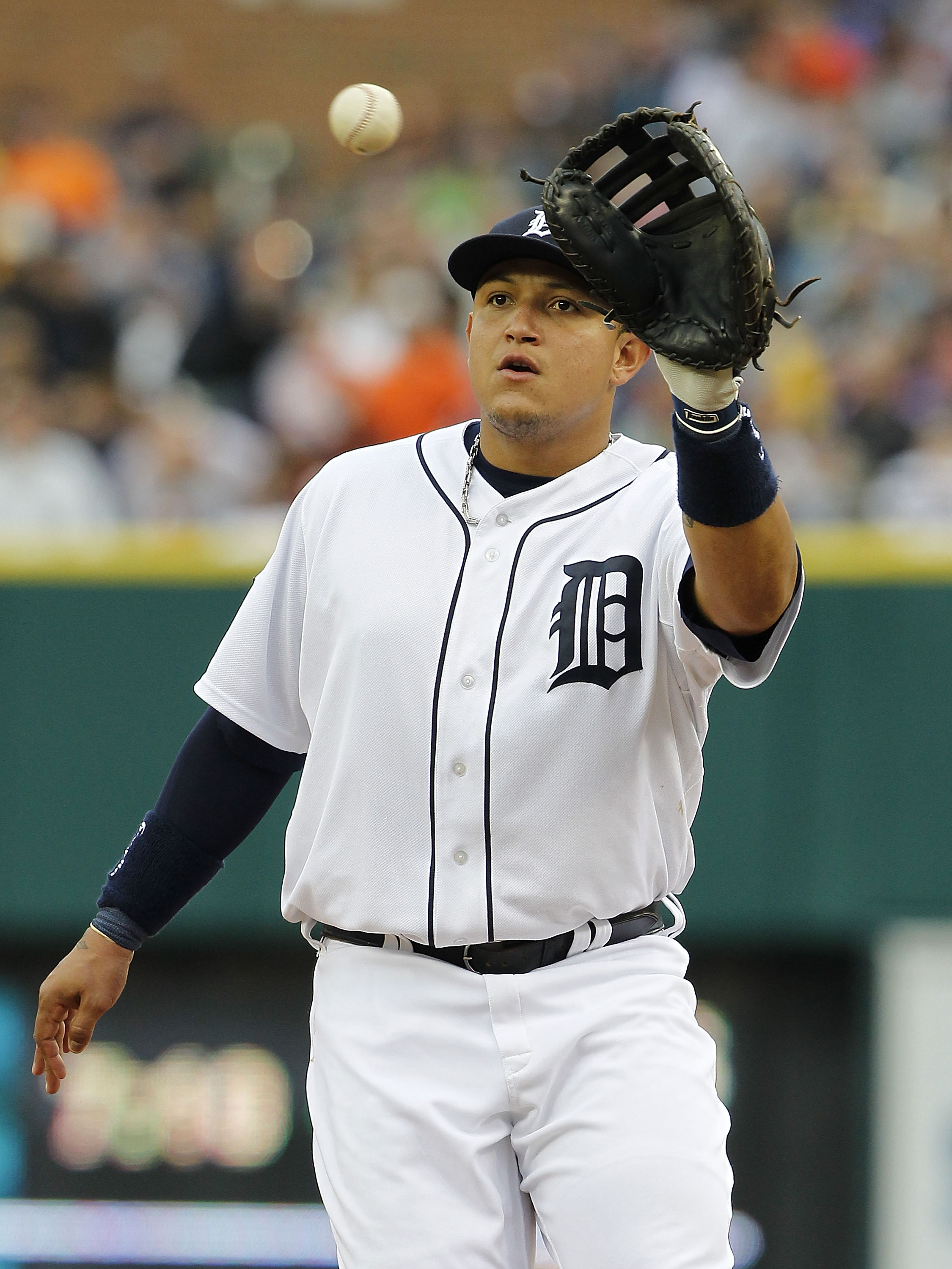 DETROIT, MI - MAY 14: Miguel Cabrera #24 of the Detroit Tigers makes the put out on Brayan Pena #27 of the Kansas City Royals in the fifth inning at Comerica Park on May 14, 2011 in Detroit, Michigan. The Tigers defeated the Royals 3-0.  (Photo by Leon Ha