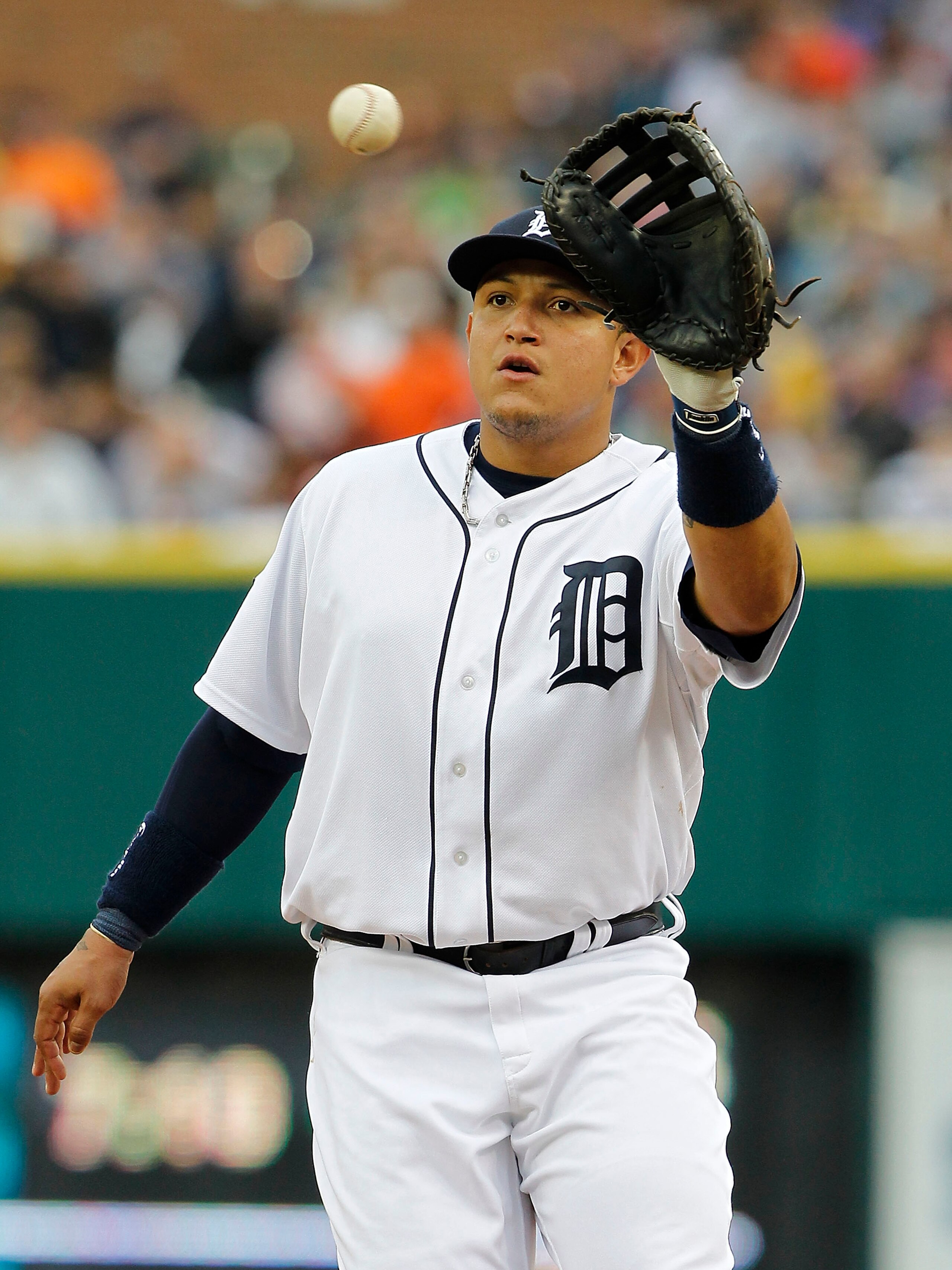 DETROIT, MI - MAY 14: Miguel Cabrera #24 of the Detroit Tigers makes the put out on Brayan Pena #27 of the Kansas City Royals in the fifth inning at Comerica Park on May 14, 2011 in Detroit, Michigan. The Tigers defeated the Royals 3-0.  (Photo by Leon Ha