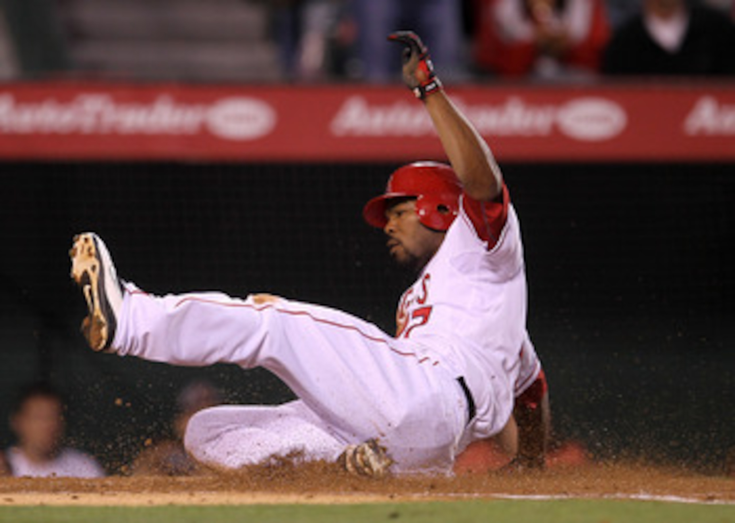 ANAHEIM, CA - MAY 10: Howie Kendrick #47 of the Los Angeles Angels of Anaheim slides home with a run in the third inning against the Chicago White Sox on May 10, 2011 at Angel Stadium in Anaheim, California.   (Photo by Stephen Dunn/Getty Images)