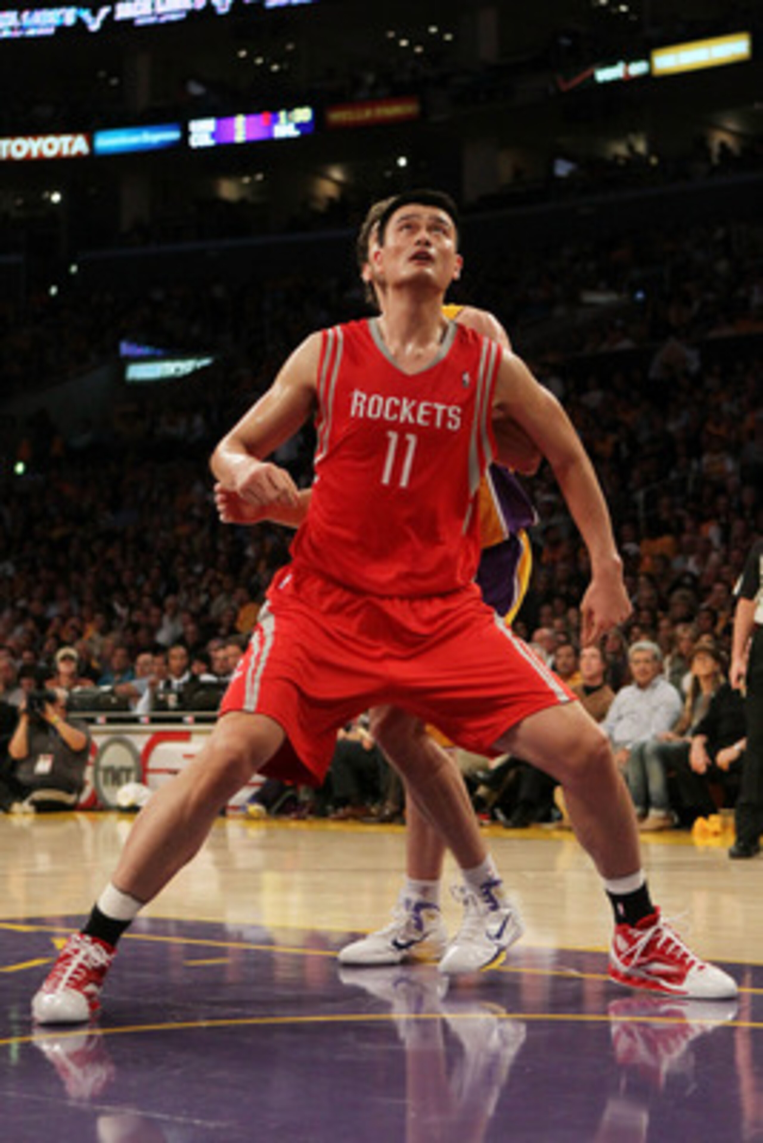 LOS ANGELES, CA - OCTOBER 26:  Yao Ming #11 of the Houston Rockets looks to rebound during their opening night game against the Los Angeles Lakers at Staples Center on October 26, 2010 in Los Angeles, California. NOTE TO USER: User expressly acknowledges 