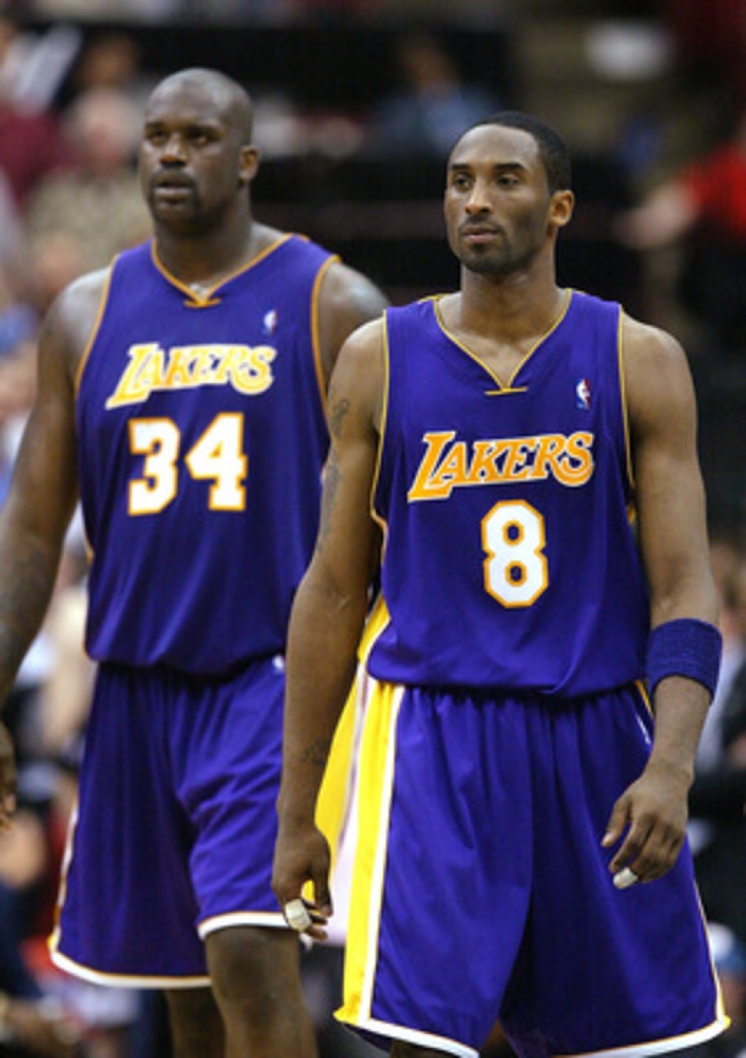 MINNEAPOLIS - MAY 29:  Kobe Bryant #8 and Shaquille O'Neal #34 of the Los Angeles Lakers walk upcourt in the fourth quarter of Game five of the Western Conference Finals against the Minnesota Timberwolves during the 2004 NBA Playoffs on May 29, 2004 at Ta