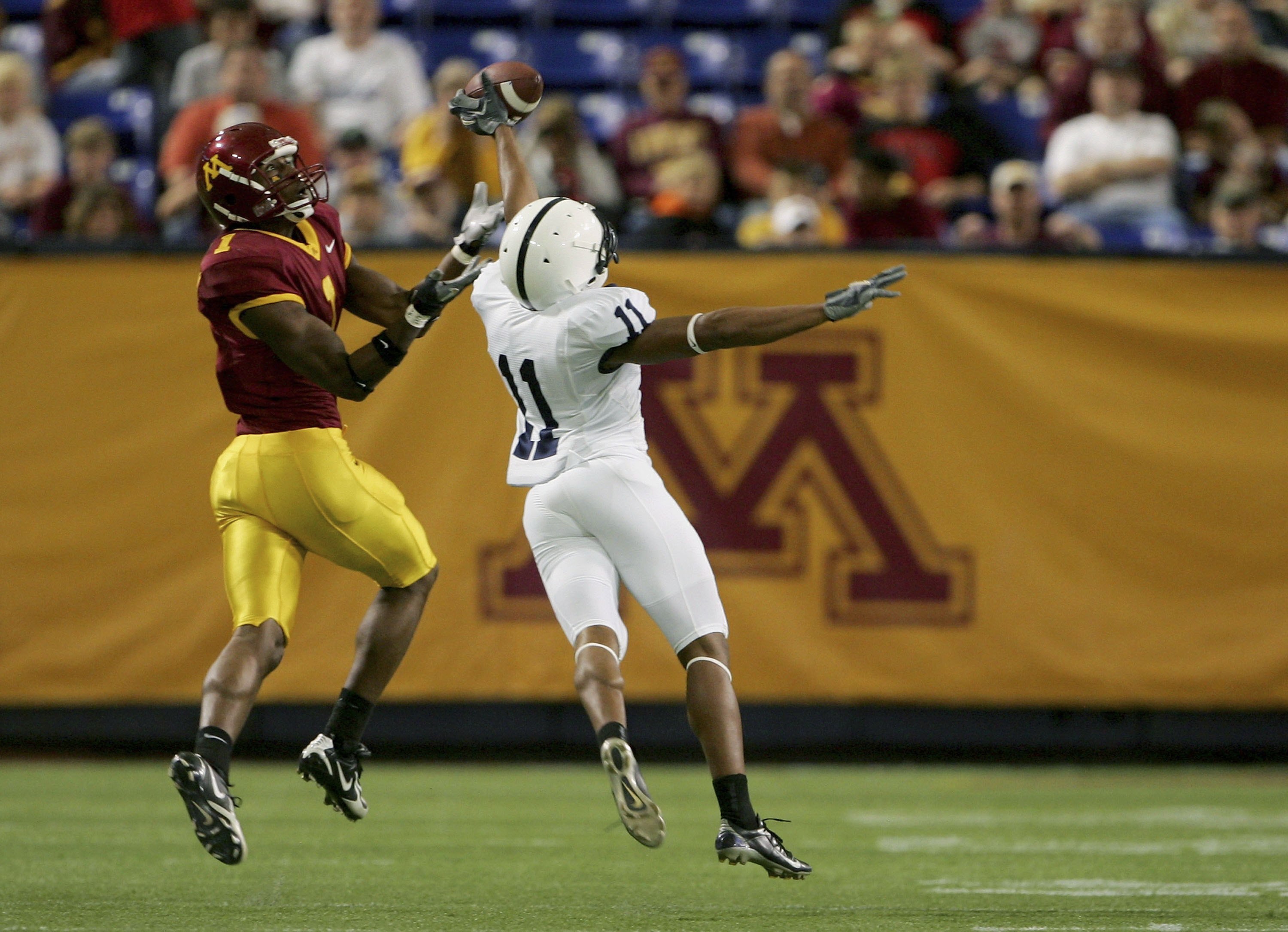 MINNEAPOLIS, MN - OCTOBER 07:  Tony Davis #11 of the Penn State Nittany Lions knocks away a pass intended for wide receiver Ernie Wheelwright #1 of the Minnesota Golden Gophers as Penn State defeated Minnesota 28-27 in overtime 28-27 on October 7, 2006 at