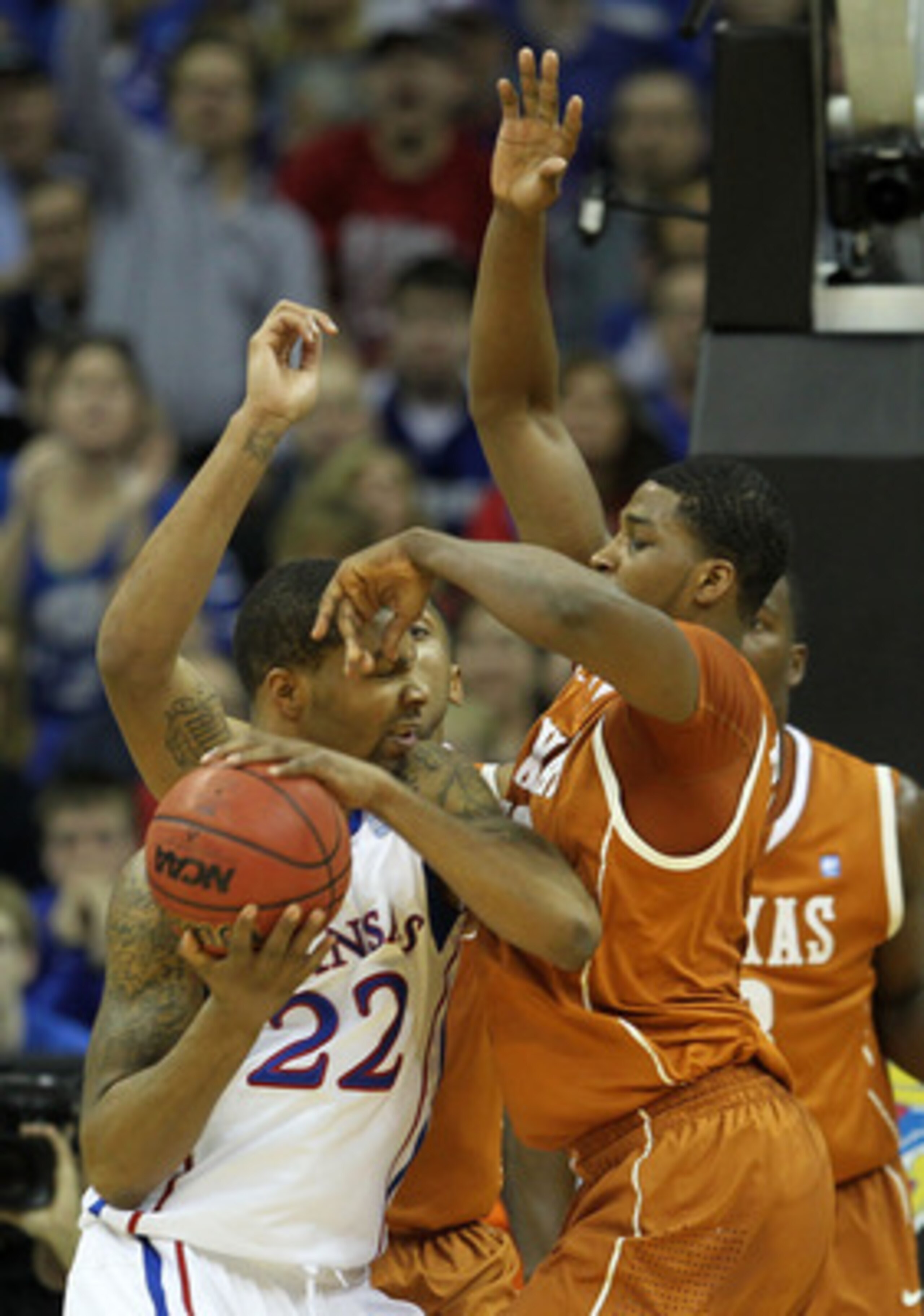 KANSAS CITY, MO - MARCH 12:  Marcus Morris #22 of the Kansas Jayhawks fights for position against Tristan Thompson #13 of the Texas Longhorns in the first half of the 2011 Phillips 66 Big 12 Men's Basketball Tournament championship game at Sprint Center o