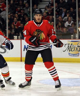 CHICAGO, IL - MARCH 23:  Chris Campoli #14 of the Chicago Blackhawks skates against the Florida Panthers at the United Center on March 23, 2011 in Chicago, Illinois. The Blackhawks defeated the Panthers 4-0.  (Photo by Bruce Bennett/Getty Images)