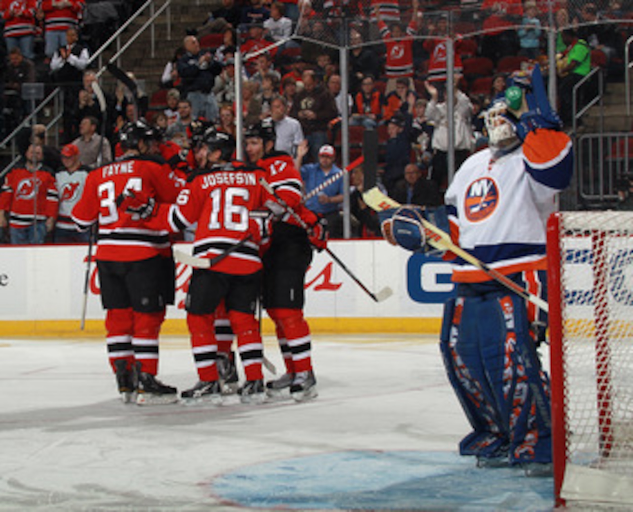 NEWARK, NJ - MARCH 30: Jacob Josefson #16 of the New Jersey Devils scores at 3:23 of the second period against Rick DiPietro #39 of the New York Islanders at the Prudential Center on March 30, 2011 in Newark, New Jersey.  (Photo by Bruce Bennett/Getty Ima