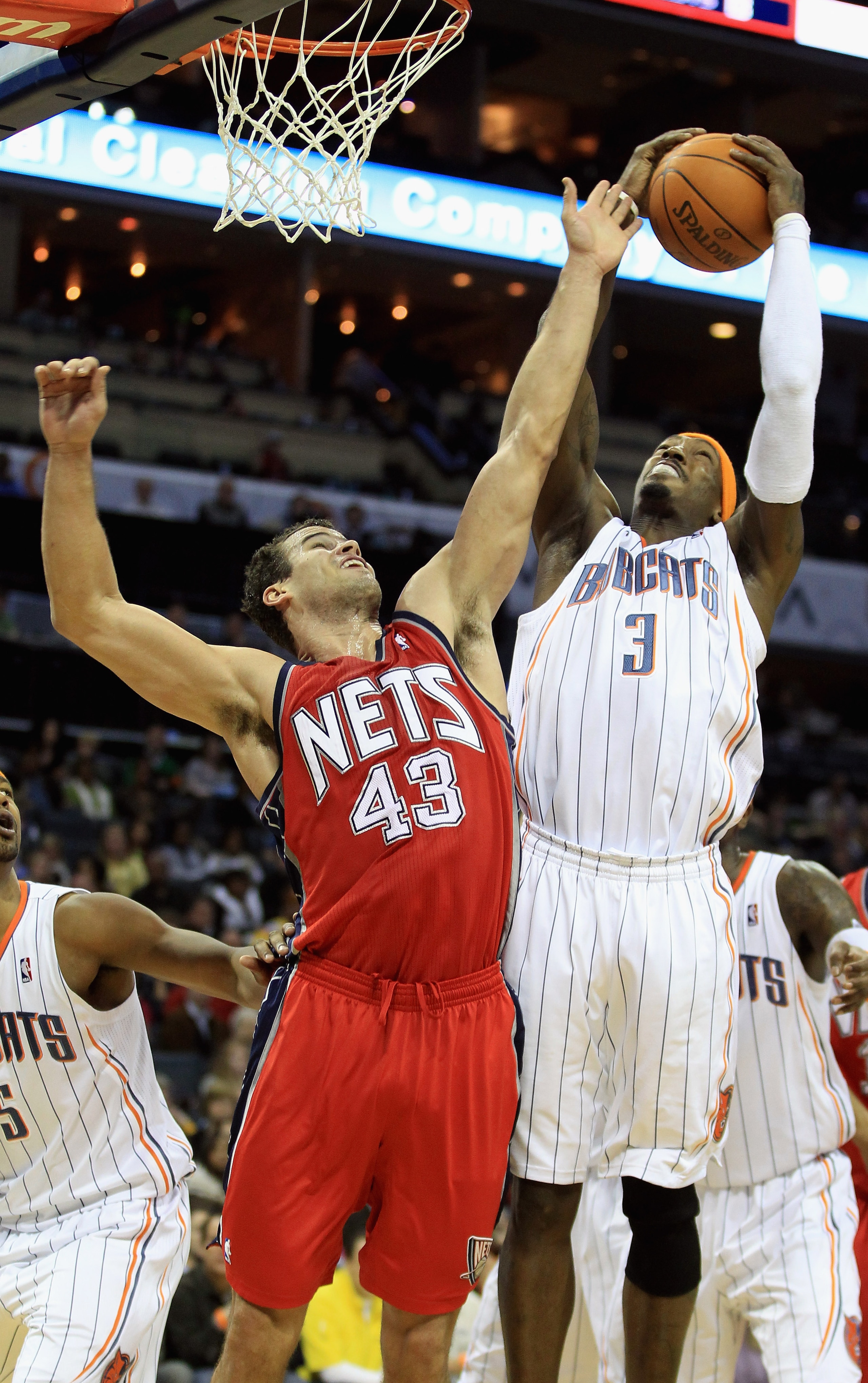 CHARLOTTE, NC - FEBRUARY 11:  Kris Humphries #43 of the New Jersey Nets battles for a rebound with Gerald Wallace #3 of the Charlotte Bobcats during their game at Time Warner Cable Arena on February 11, 2011 in Charlotte, North Carolina. NOTE TO USER: Use