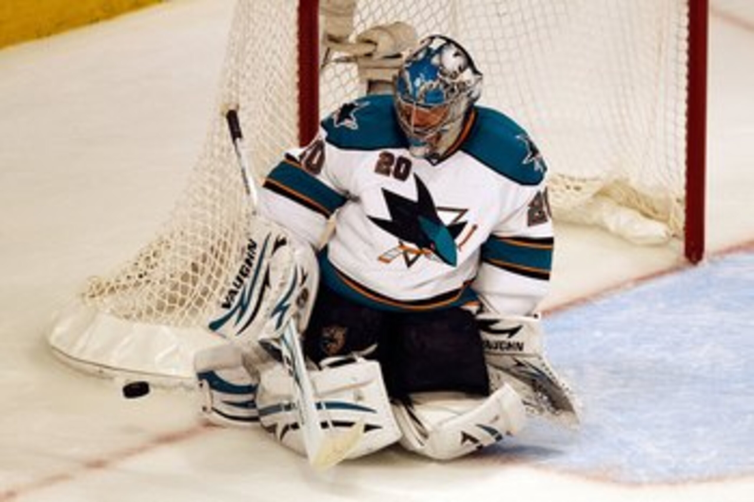 CHICAGO - MAY 23:  Goaltender Evgeni Nabokov #20 of the San Jose Sharks makes a save while taking on the Chicago Blackhawks in Game Four of the Western Conference Finals during the 2010 NHL Stanley Cup Playoffs at the United Center on May 23, 2010 in Chic