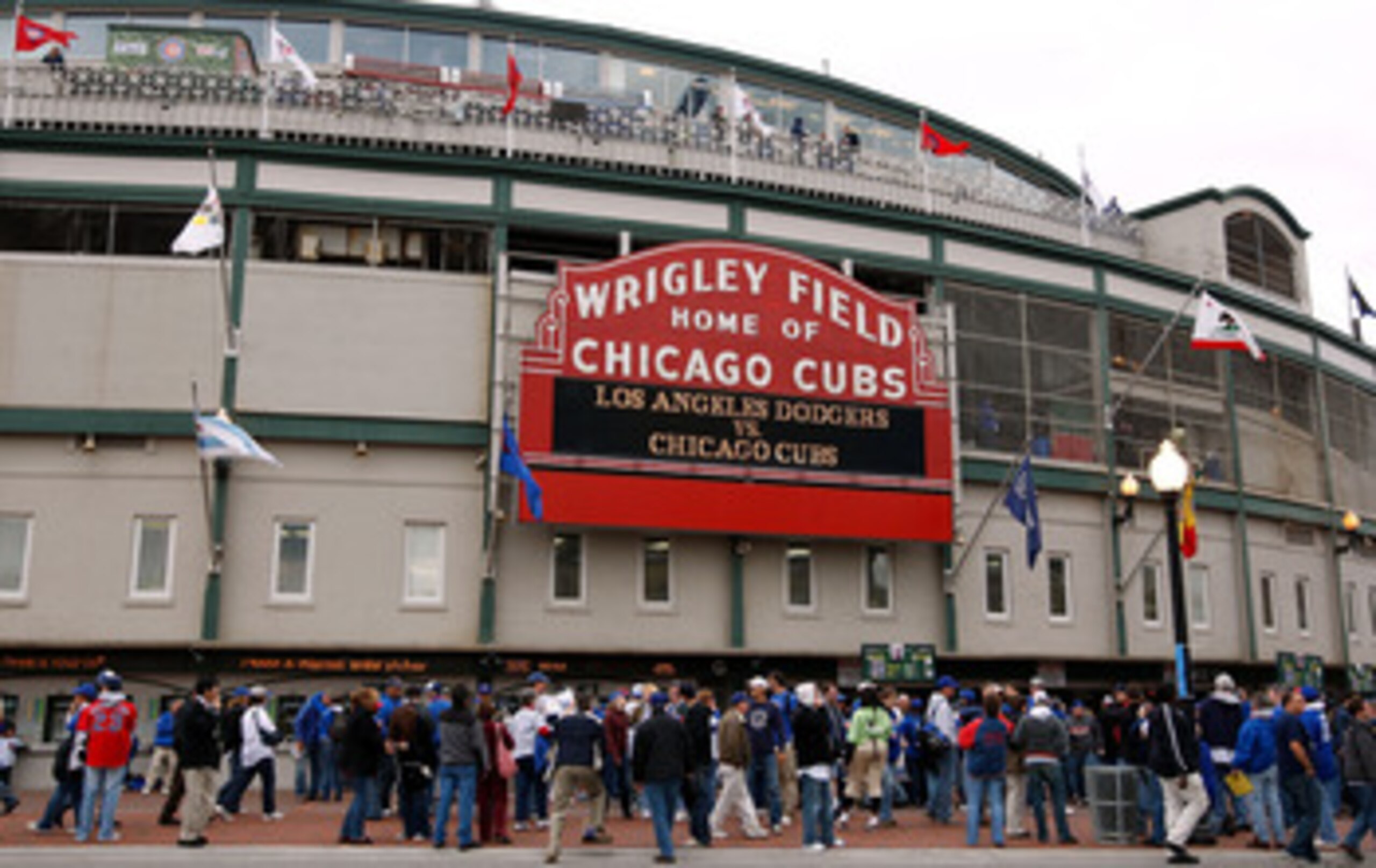 CHICAGO - OCTOBER 01:  Fans stand outside Wrigley Field under the famous marquee, which reads Los Angeles Dodgers vs. Chicago Cubs' prior to the Cubs hosting the Dodgers in Game One of the NLDS during the 2008 MLB Playoffs at Wrigley Field on October 1, 2