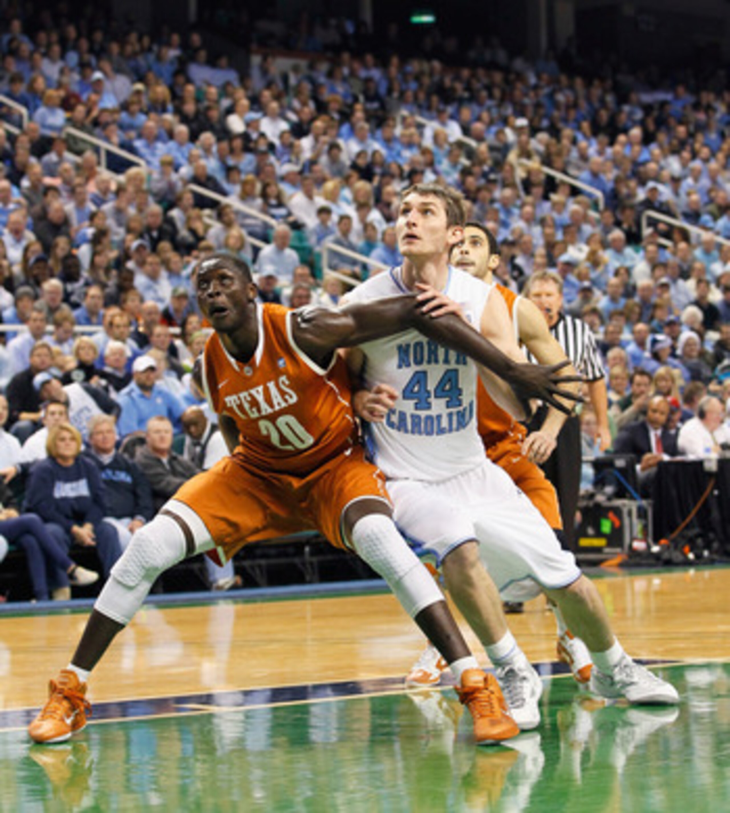 GREENSBORO, NC - DECEMBER 18:  Tyler Zeller #44 of the North Carolina Tar Heels against Alexis Wangmene #20 of the Texas Longhorns at Greensboro Coliseum on December 18, 2010 in Greensboro, North Carolina.  (Photo by Kevin C. Cox/Getty Images)
