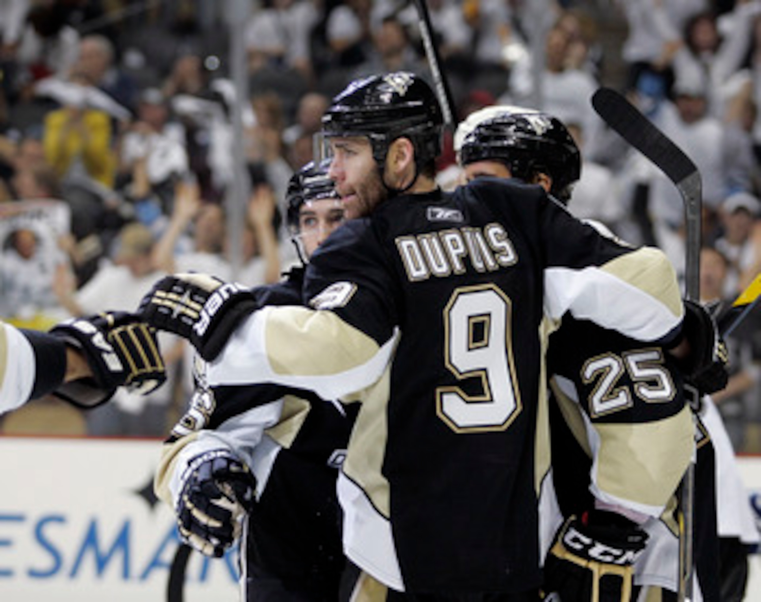 PITTSBURGH, PA - APRIL 23:  Chris Conner #16 of the Pittsburgh Penguins celebrates his third period goal with Pascal Dupuis #9 against the Tampa Bay Lightning in Game Five of the Eastern Conference Quarterfinals during the 2011 NHL Stanley Cup Playoffs at
