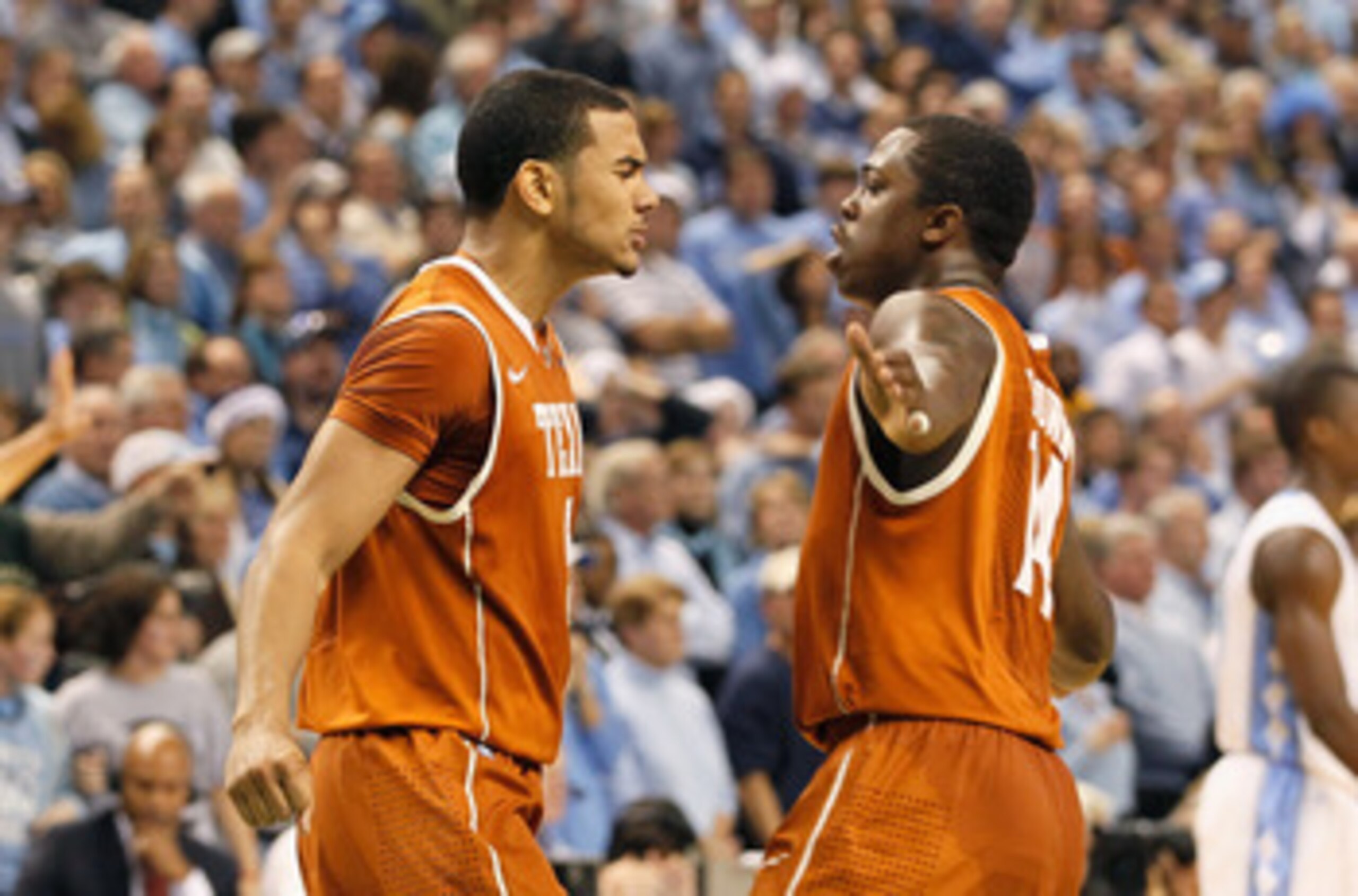 GREENSBORO, NC - DECEMBER 18:  Cory Joseph #5 of the Texas Longhorns reacts with J'Covan Brown #14 after Joseph hit what became the game-winning basket against the North Carolina Tar Heels Greensboro Coliseum on December 18, 2010 in Greensboro, North Caro