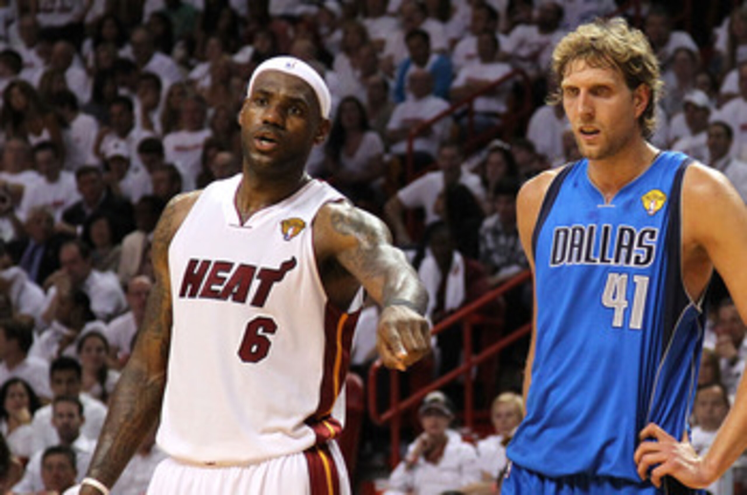 MIAMI, FL - MAY 31:  Chris Bosh #1 of the Miami Heat runs back up court ahead of Tyson Chandler #6 of the Dallas Mavericks in Game One of the 2011 NBA Finals at American Airlines Arena on May 31, 2011 in Miami, Florida. NOTE TO USER: User expressly acknow