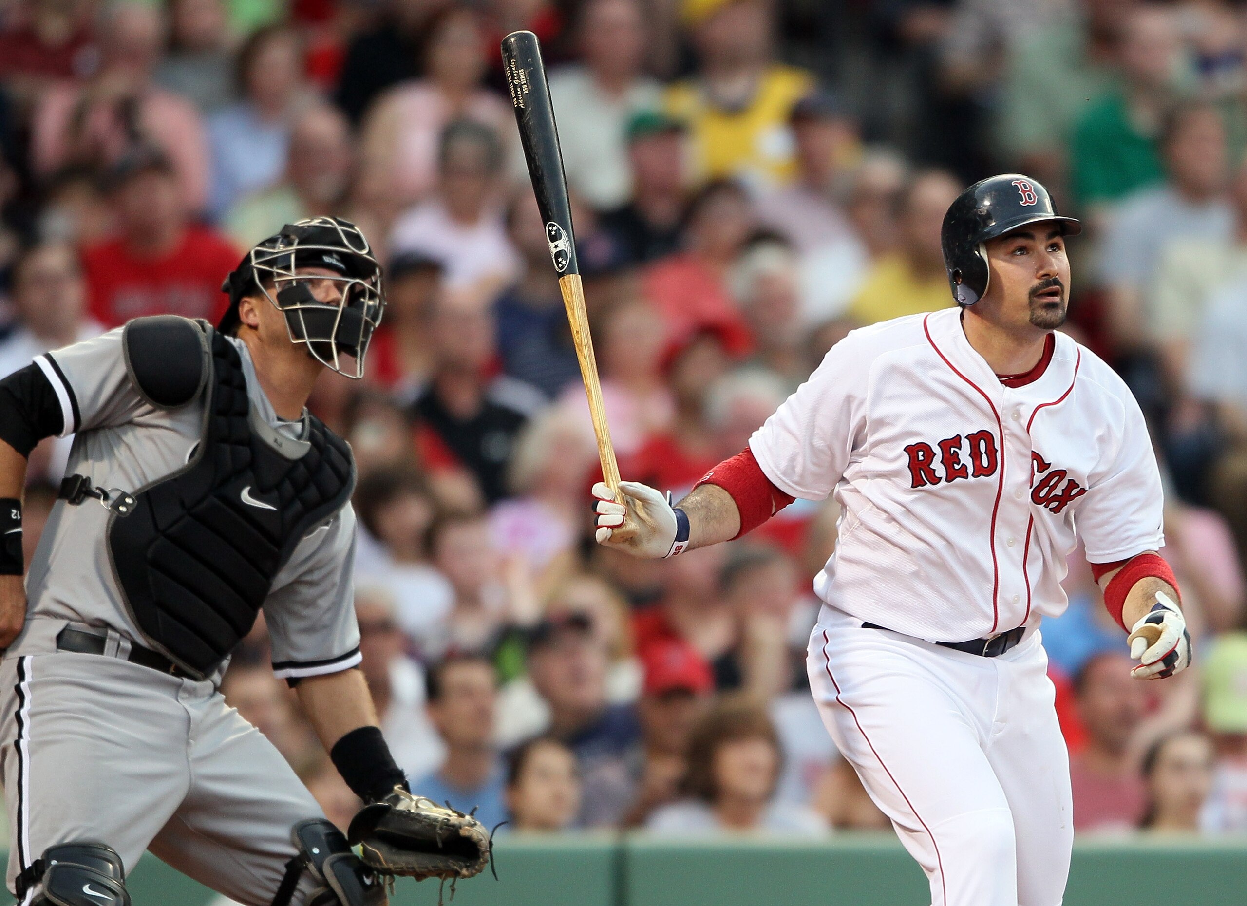 BOSTON, MA - MAY 30:  Adrian Gonzalez #28 of the Boston Red Sox and A.J. Pierzynski #12 of the Chicago White Sox watch Gonzalez's solo home run in the first inning on May 30, 2011 at Fenway Park in Boston, Massachusetts.  (Photo by Elsa/Getty Images)