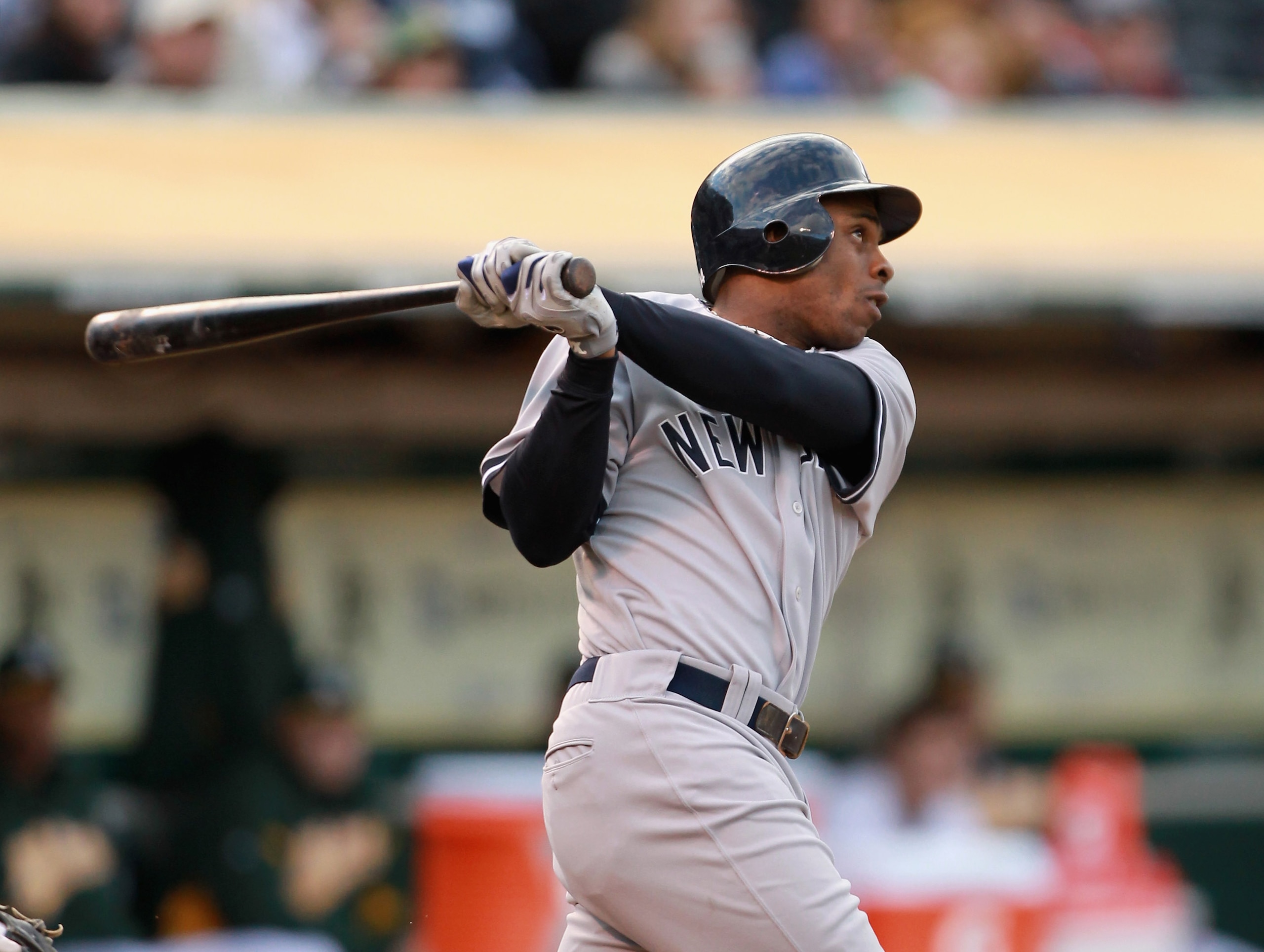 OAKLAND, CA - MAY 31:  Curtis Granderson #14 of the New York Yankees hits a two run home run in the first inning against the Oakland Athletics at Oakland-Alameda County Coliseum on May 31, 2011 in Oakland, California.  (Photo by Ezra Shaw/Getty Images)