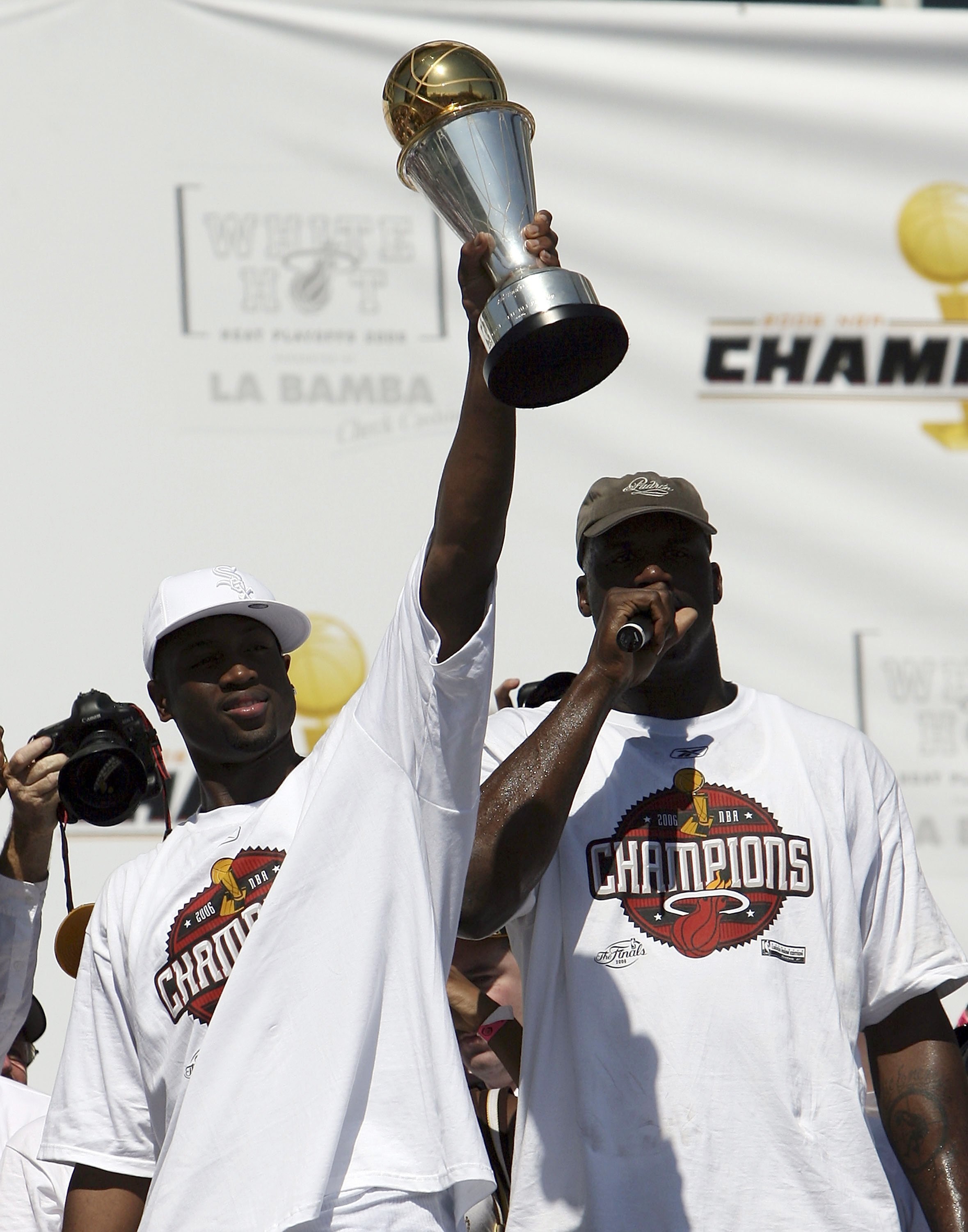 MIAMI - JUNE 23:  Shaquille O'Neal #32 (R) and Dwyane Wade #3 of the Miami Heat celebrates during the victory parade and celebration at American Airlines Arena on June 23, 2006 in Miami, Florida. NOTE TO USER: User expressly acknowledges and agrees that,
