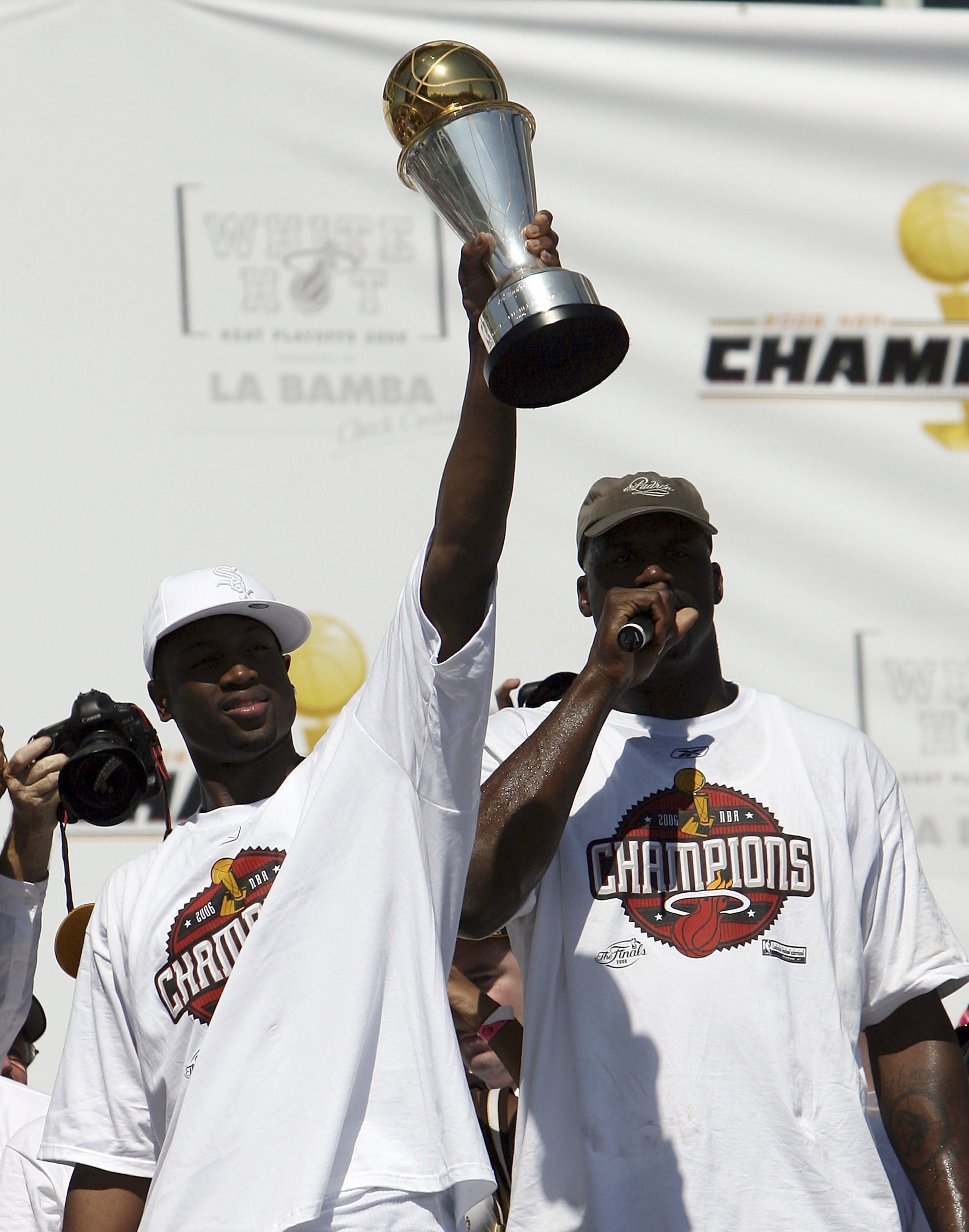 MIAMI - JUNE 23:  Shaquille O'Neal #32 (R) and Dwyane Wade #3 of the Miami Heat celebrates during the victory parade and celebration at American Airlines Arena on June 23, 2006 in Miami, Florida. NOTE TO USER: User expressly acknowledges and agrees that,