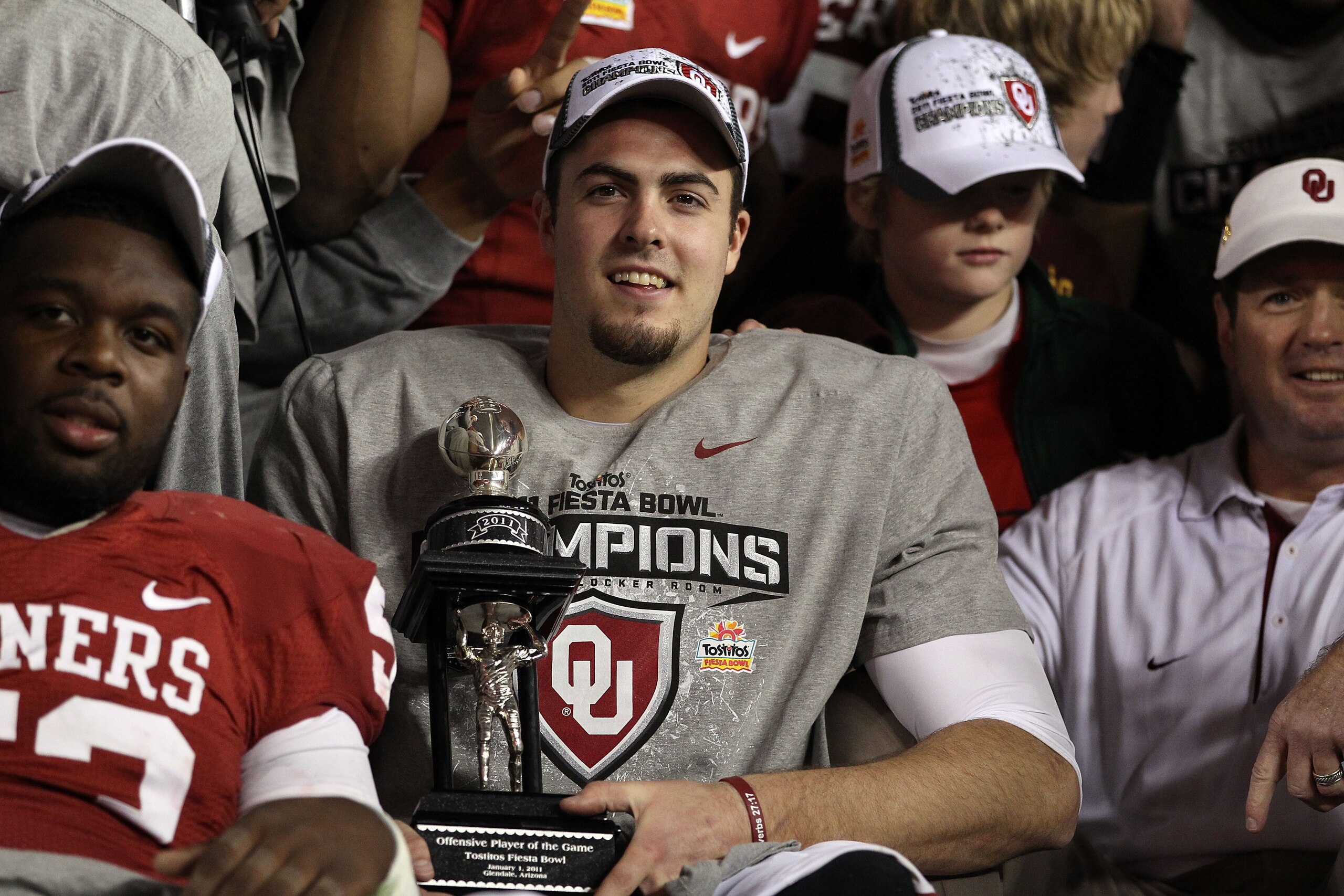 GLENDALE, AZ - JANUARY 01:  Quarterback Landry Jones #12 of the Oklahoma Sooners and offensive MVP celebrates the Sooners 48-20 victory against the Connecticut Huskies during the Tostitos Fiesta Bowl at the Universtity of Phoenix Stadium on January 1, 201