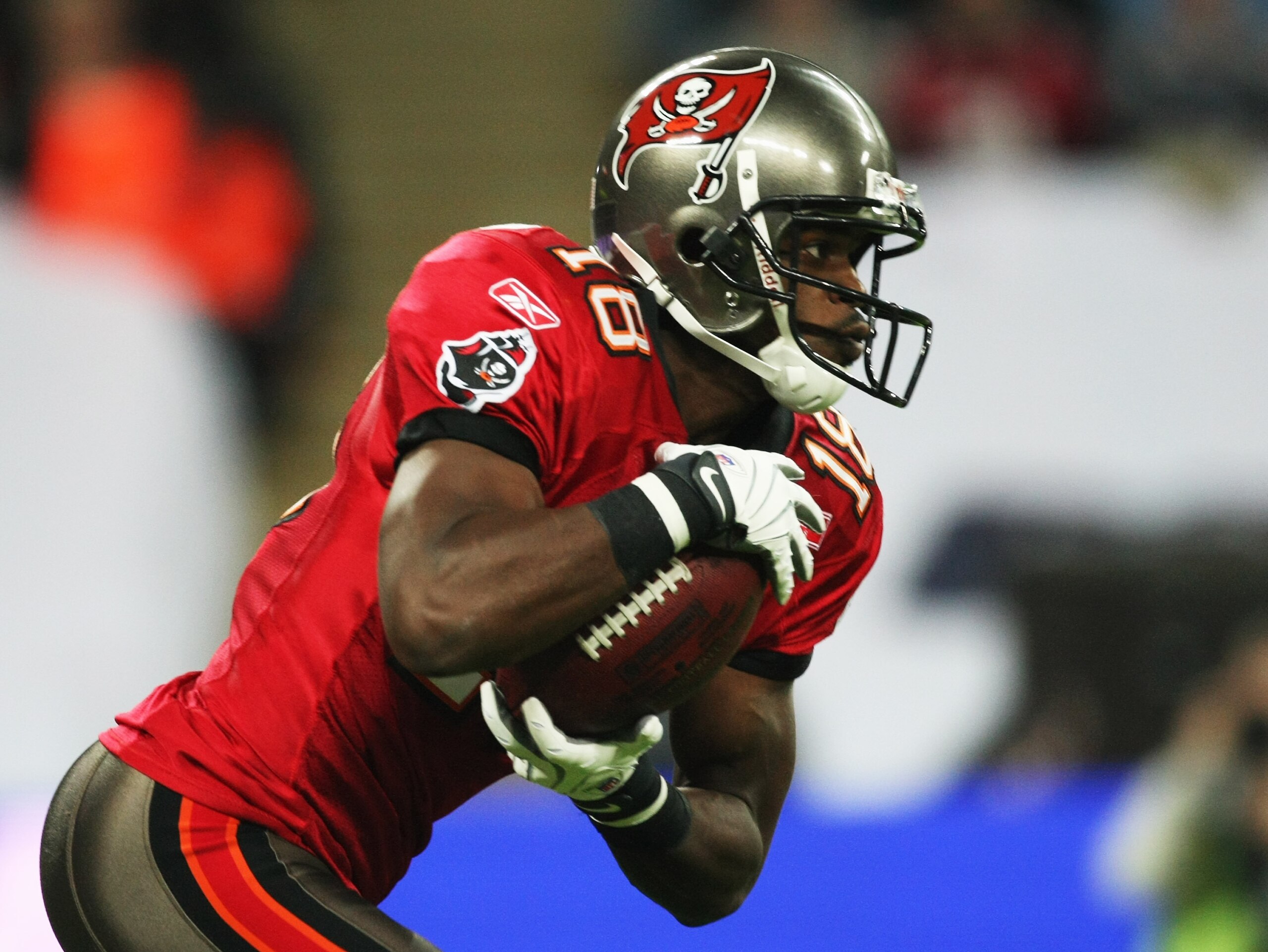 LONDON, ENGLAND - OCTOBER 25: Sammie Stroughter (#18) of Tampa Bay Buccaneers   returns a kick off during the NFL International Series match between New England Patriots and Tampa Bay Buccaneers at Wembley Stadium on October 25, 2009 in London, England. T