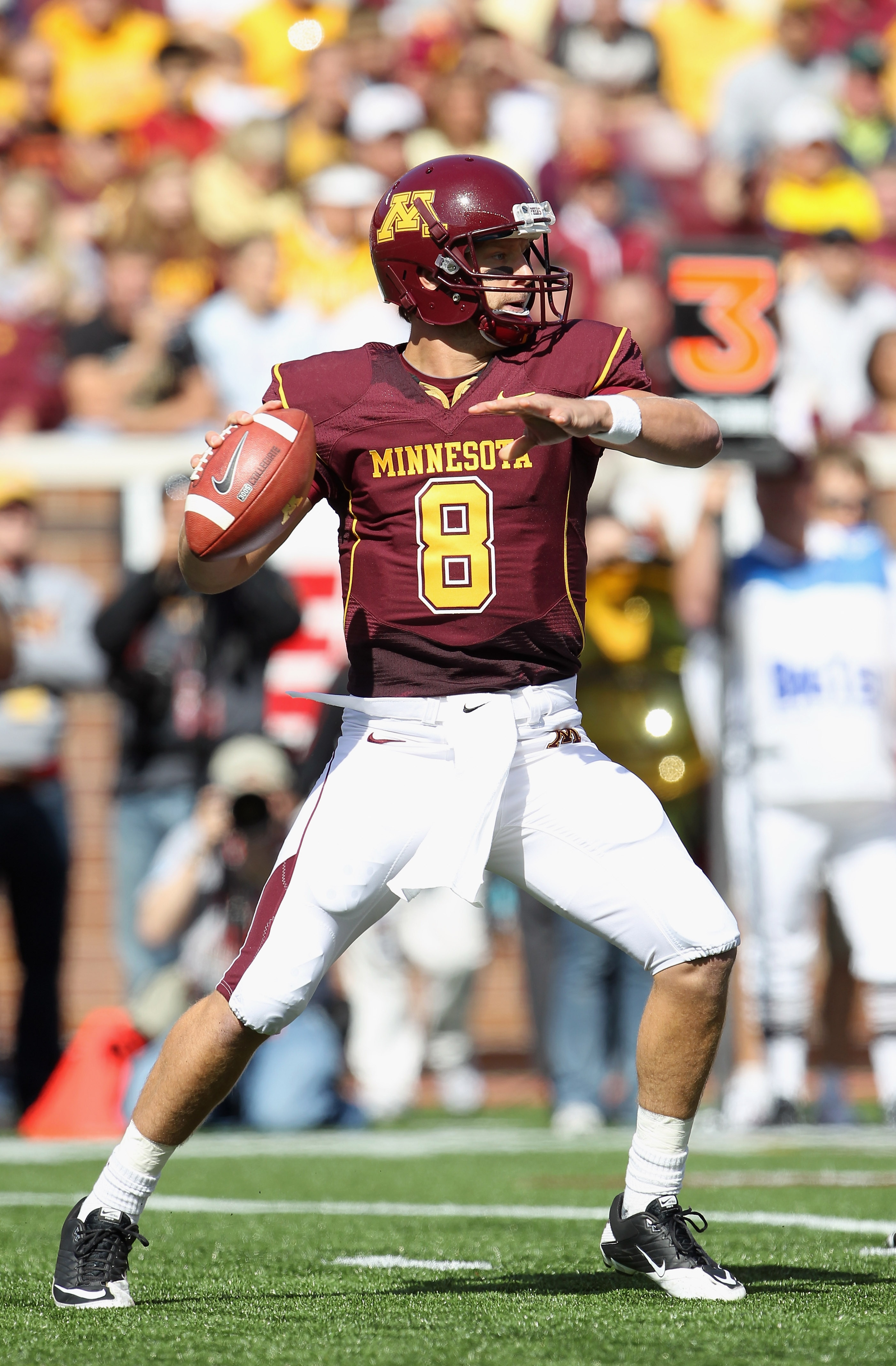 MINNEAPOLIS - SEPTEMBER 18:  Quarterback Adam Weber #8 of the Minnesota Golden Gophers passes during the game against the USC Trojans on September 18, 2010 at TCF Bank Stadium in Minneapolis, Minnesota.  (Photo by Jamie Squire/Getty Images)