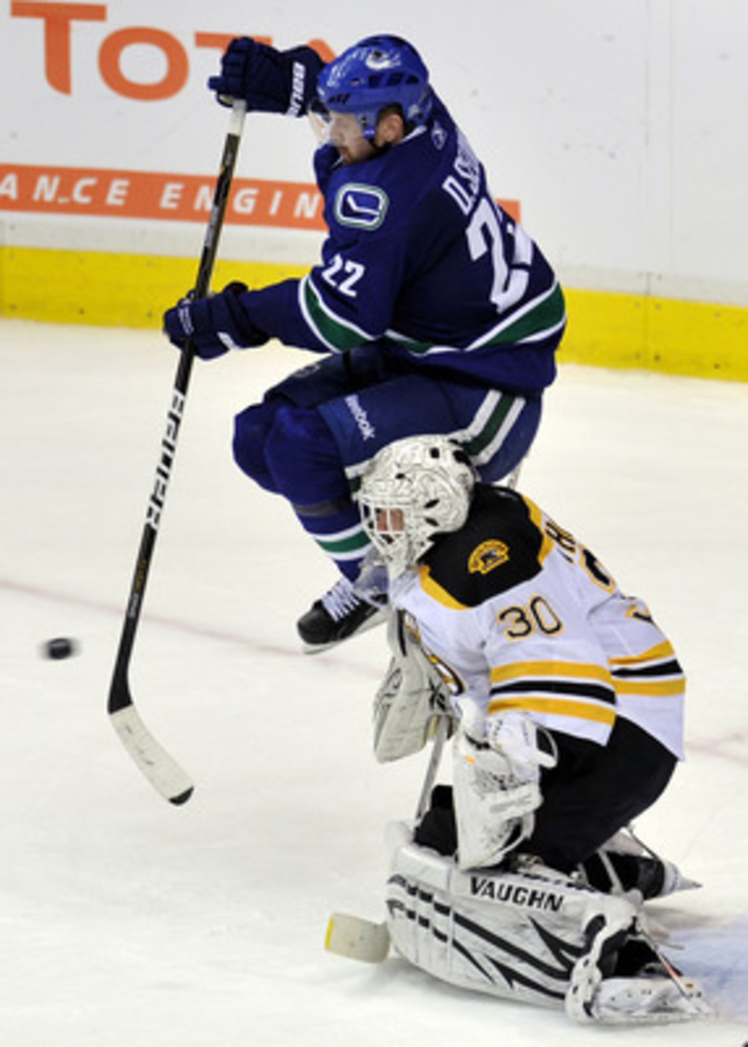 VANCOUVER, BC - JUNE 01:  Tim Thomas #30 of the Boston Bruins tends goal against Daniel Sedin #22 of the Vancouver Canucks during game one of the 2011 NHL Stanley Cup Finals at Rogers Arena on June 1, 2011 in Vancouver, Canada.  (Photo by Nick Didlick/Get