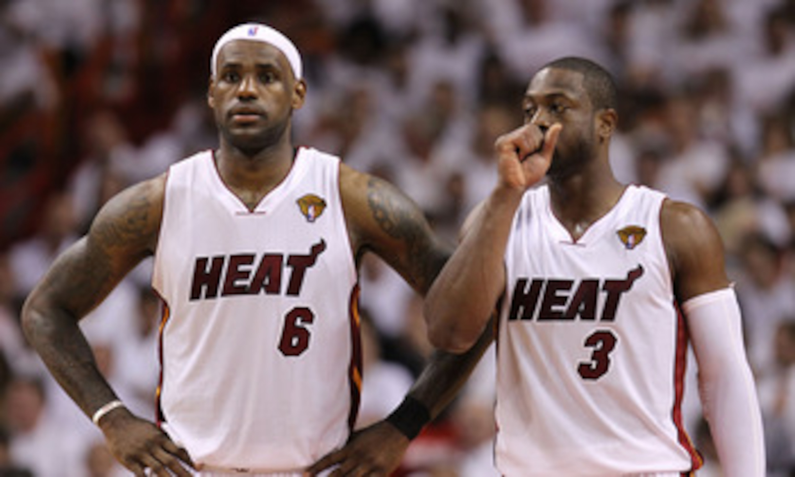 MIAMI, FL - MAY 31:  LeBron James #6 and Dwyane Wade #3 of the Miami Heat react in the fourth quarter before the Heat defeat the Dallas Mavericks 92-84 in Game One of the 2011 NBA Finals at American Airlines Arena on May 31, 2011 in Miami, Florida. NOTE T