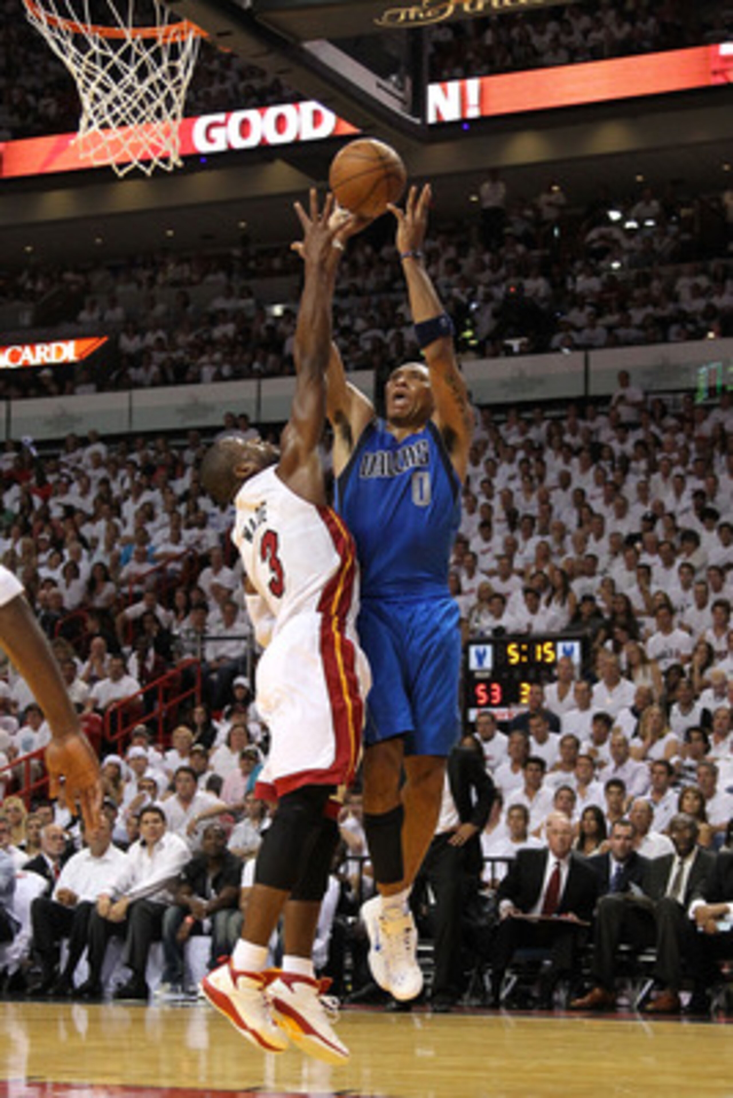 MIAMI, FL - MAY 31:  Shawn Marion #0 of the Dallas Mavericks shoots over Dwyane Wade #3 of the Miami Heat in the third quarter in Game One of the 2011 NBA Finals at American Airlines Arena on May 31, 2011 in Miami, Florida. NOTE TO USER: User expressly ac
