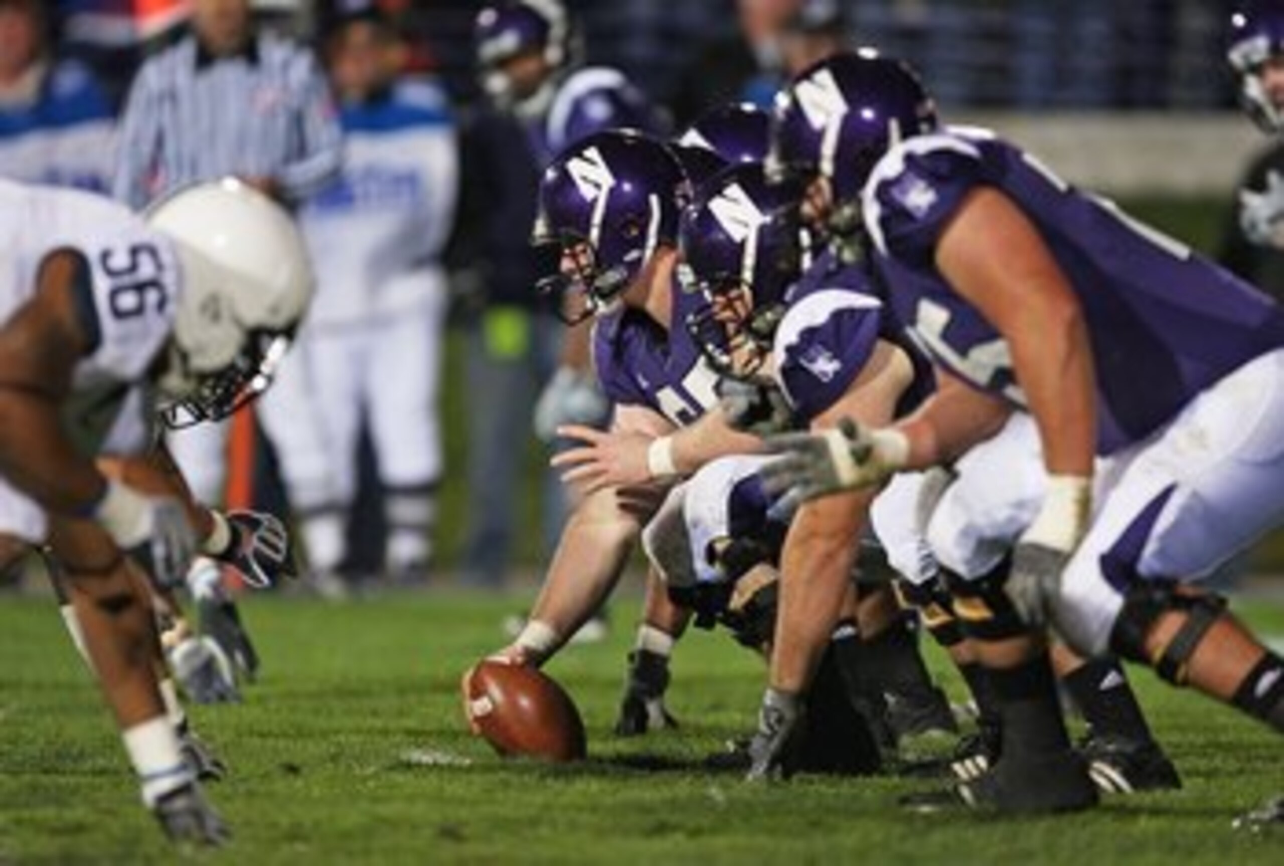 EVANSTON, IL - OCTOBER 31: Ben Burkett #65 of the Northwestern Wildcats prepares to snap the ball against the Penn State Nittany Lions at Ryan Field on October 31, 2009 in Evanston, Illinois. Penn State defeated Northwestern 34-13. (Photo by Jonathan Dani