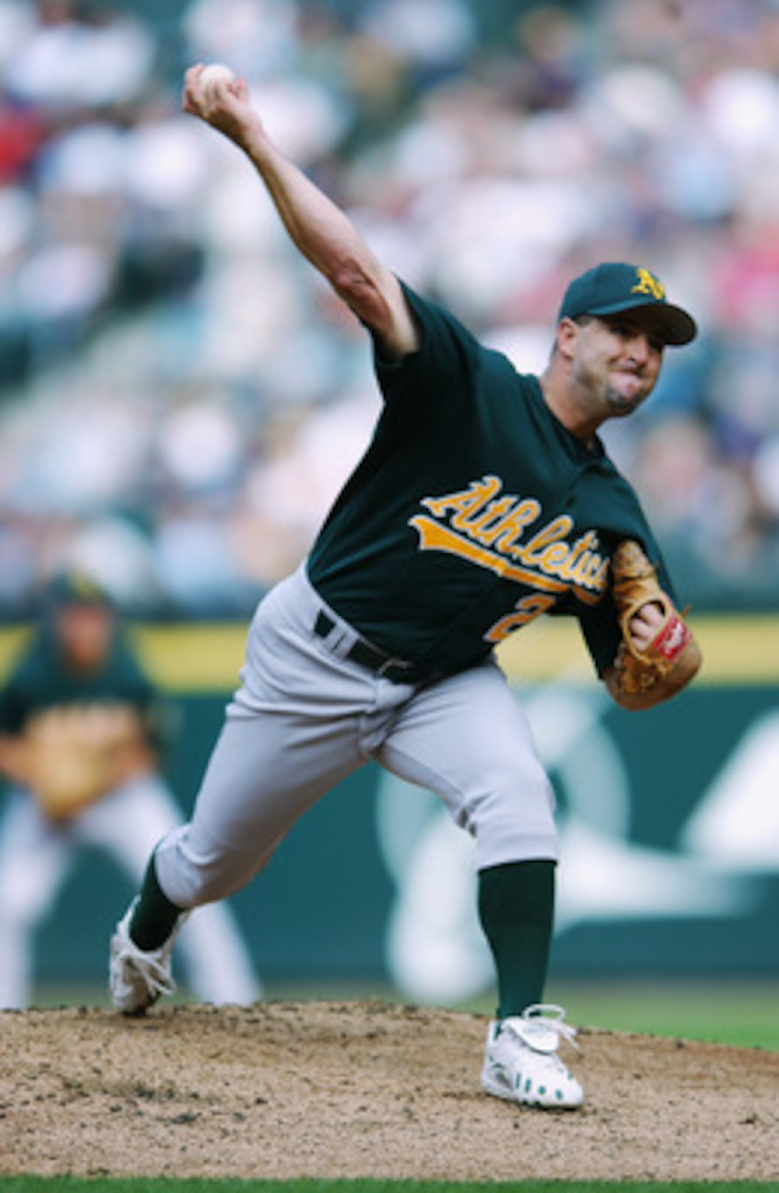 SEATTLE - SEPTEMBER 26:  Cory Lidle #21 of the Oakland A's pitches the ball during their game  against the Seattle Mariners the on September 26, 2002 at Safeco Field in Seattle, Washington. (Photo by:  Otto Greule Jr/Getty Images)