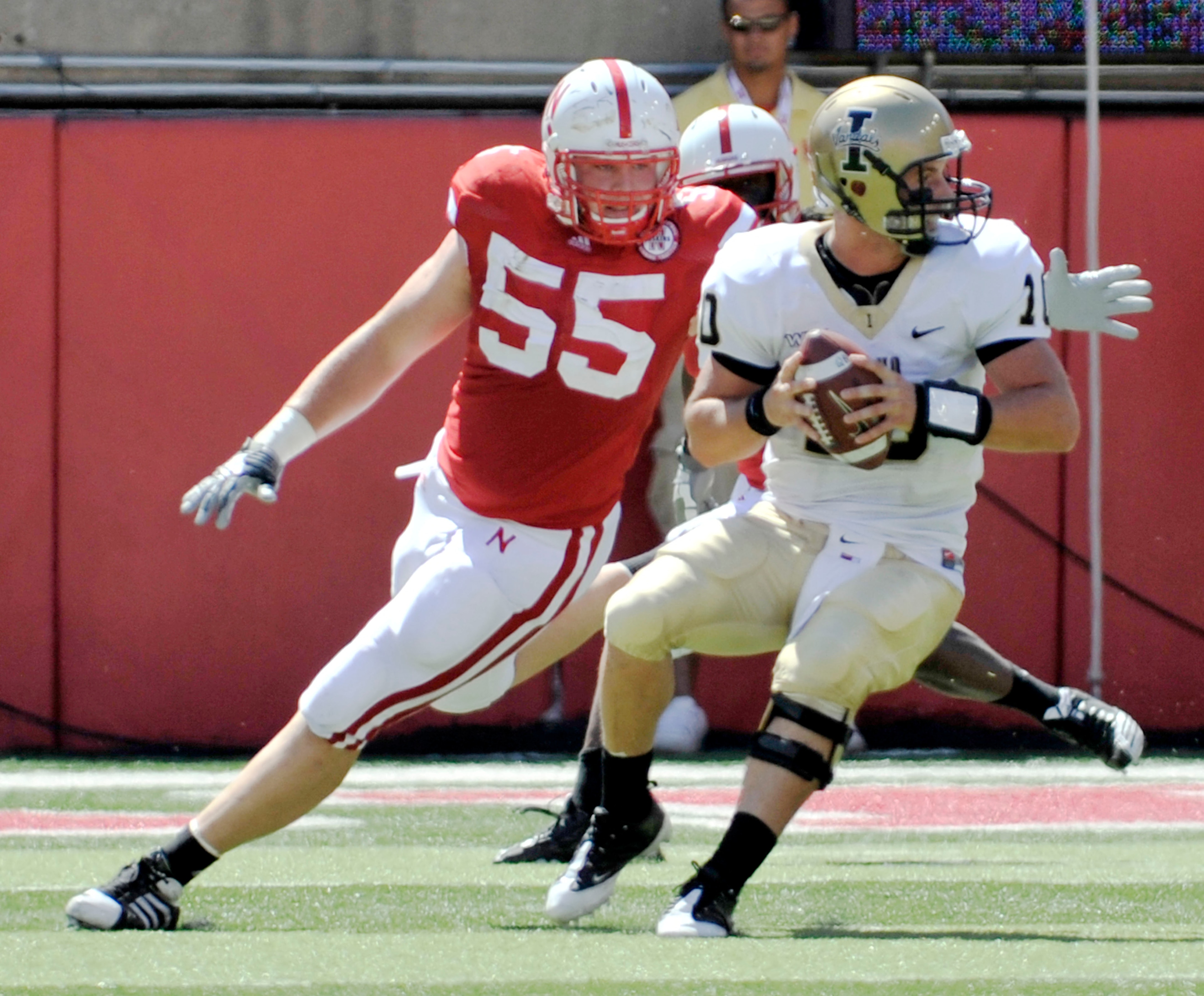 LINCOLN, NEBRASKA - SEPTEMBER 11: Idaho Vandals quarterback Nathan Enderle #10 tries to elude over Nebraska Cornhuskers defensive tackle Baker Steinkuhler #55 during first half action of their game at Memorial Stadium on September 4, 2010 in Lincoln, Nebr