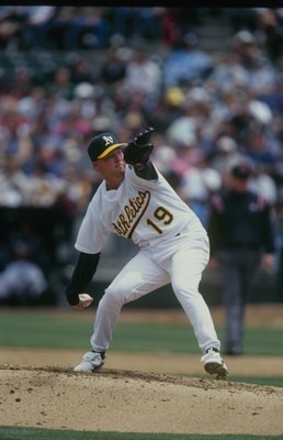 OAKLAND, CA - MAY 13:  Kevin Appier #19 of the Oakland Athletics pitches during the game against the Seattle Mariners at Network Associates Coliseum on May 13, 2000 in Oakland, California. (Photo by Stephen Dunn/Getty Images)