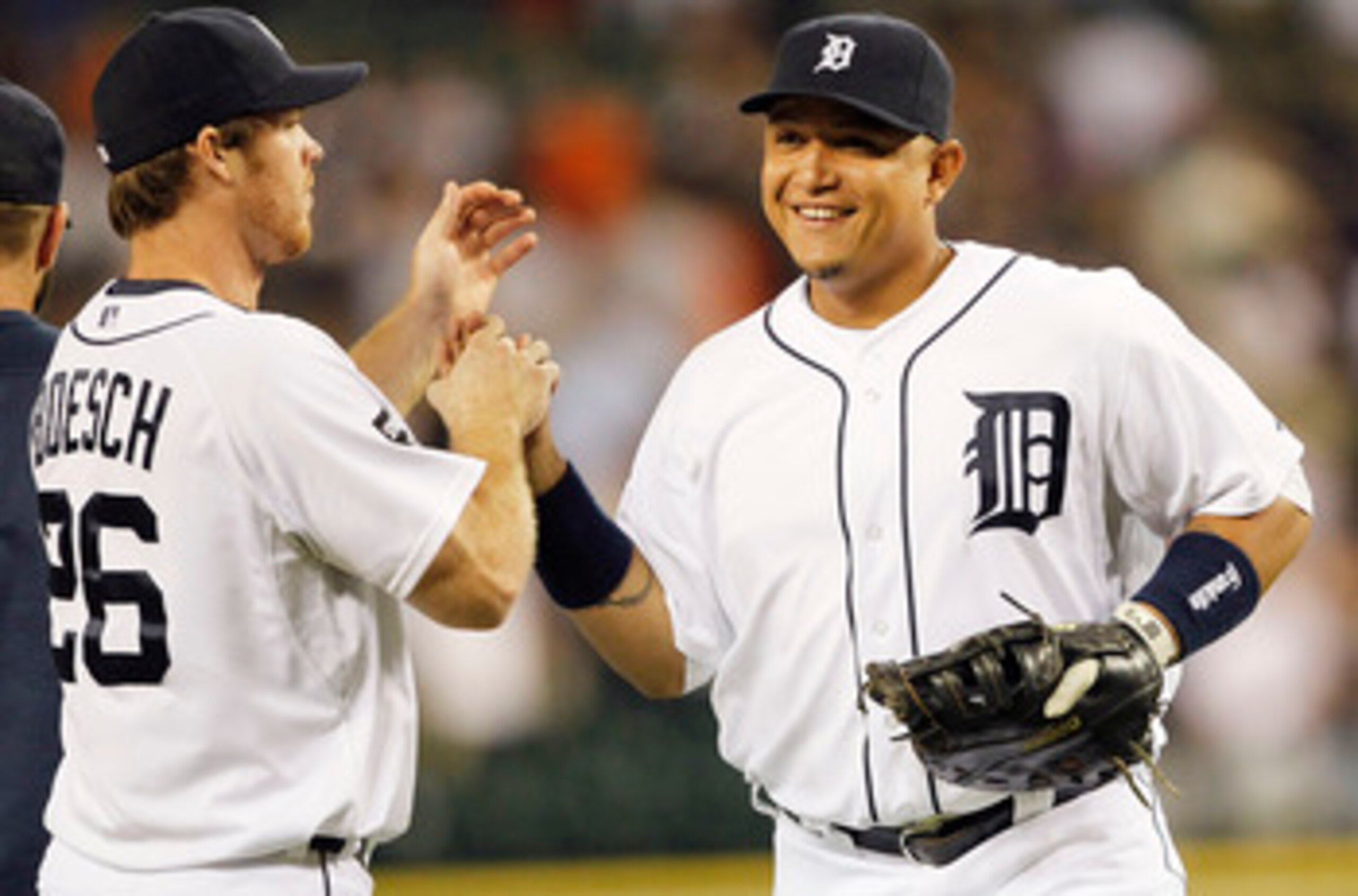 DETROIT - JUNE 01: Brennan Boesch #26 and Miguel Cabrera #24 of the Detroit Tigers celebrate a 4-2 win over the Minnesota Twins at Comerica Park on June 1, 2011 in Detroit, Michigan. (Photo by Leon Halip/Getty Images)