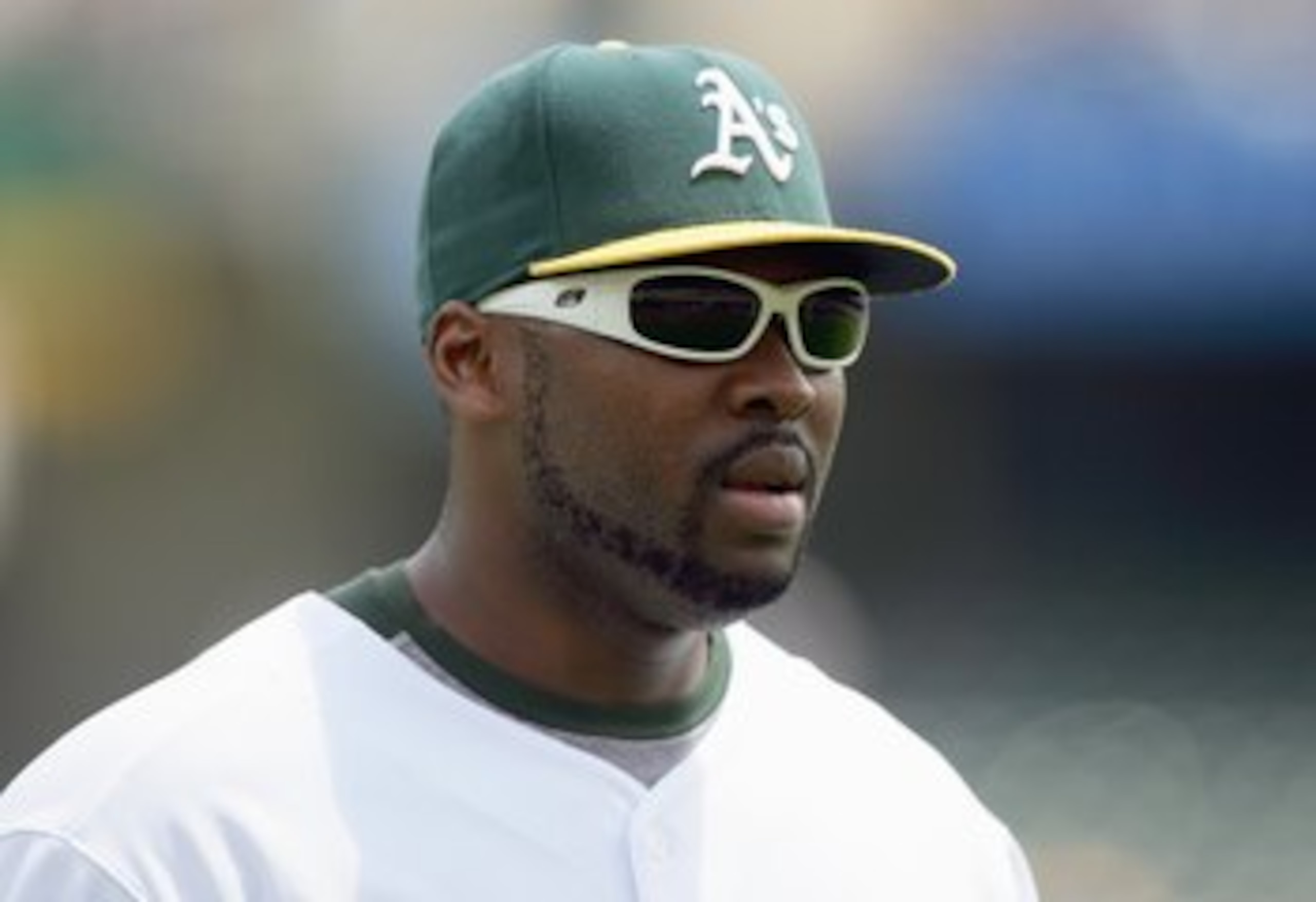 OAKLAND, CA - MAY 30: Milton Bradley #22 of the Oakland Athletics looks on against the Texas Rangers during a Major League Baseball game on May 30, 2007 at McAfee Coliseum in Oakland, California. (Photo by Jed Jacobsohn/Getty Images)