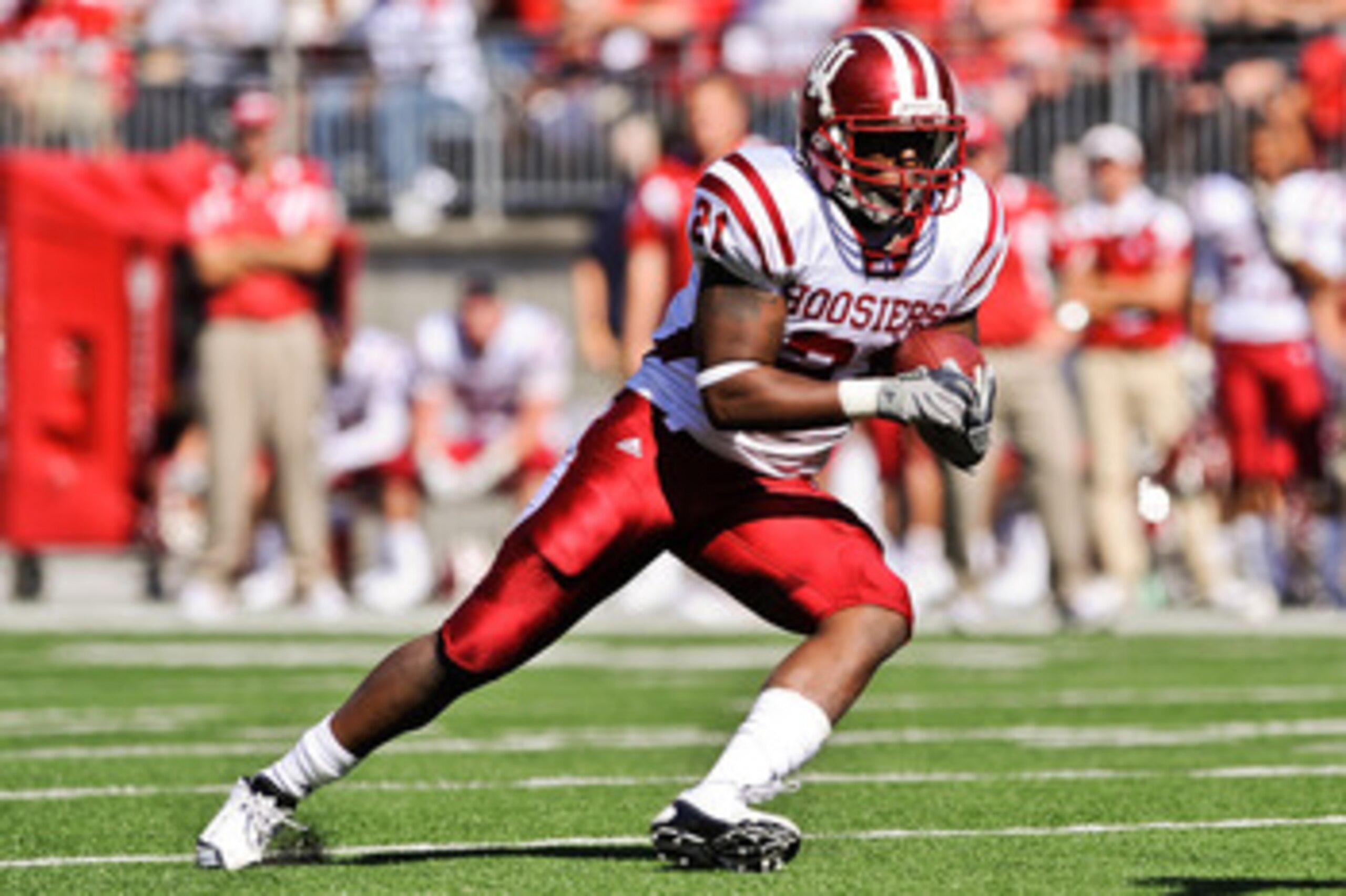 COLUMBUS, OH - OCTOBER 9:  Trea Burgess #21 of the Indiana Hoosiers runs with the ball against the Ohio State Buckeyes at Ohio Stadium on October 9, 2010 in Columbus, Ohio.  (Photo by Jamie Sabau/Getty Images)