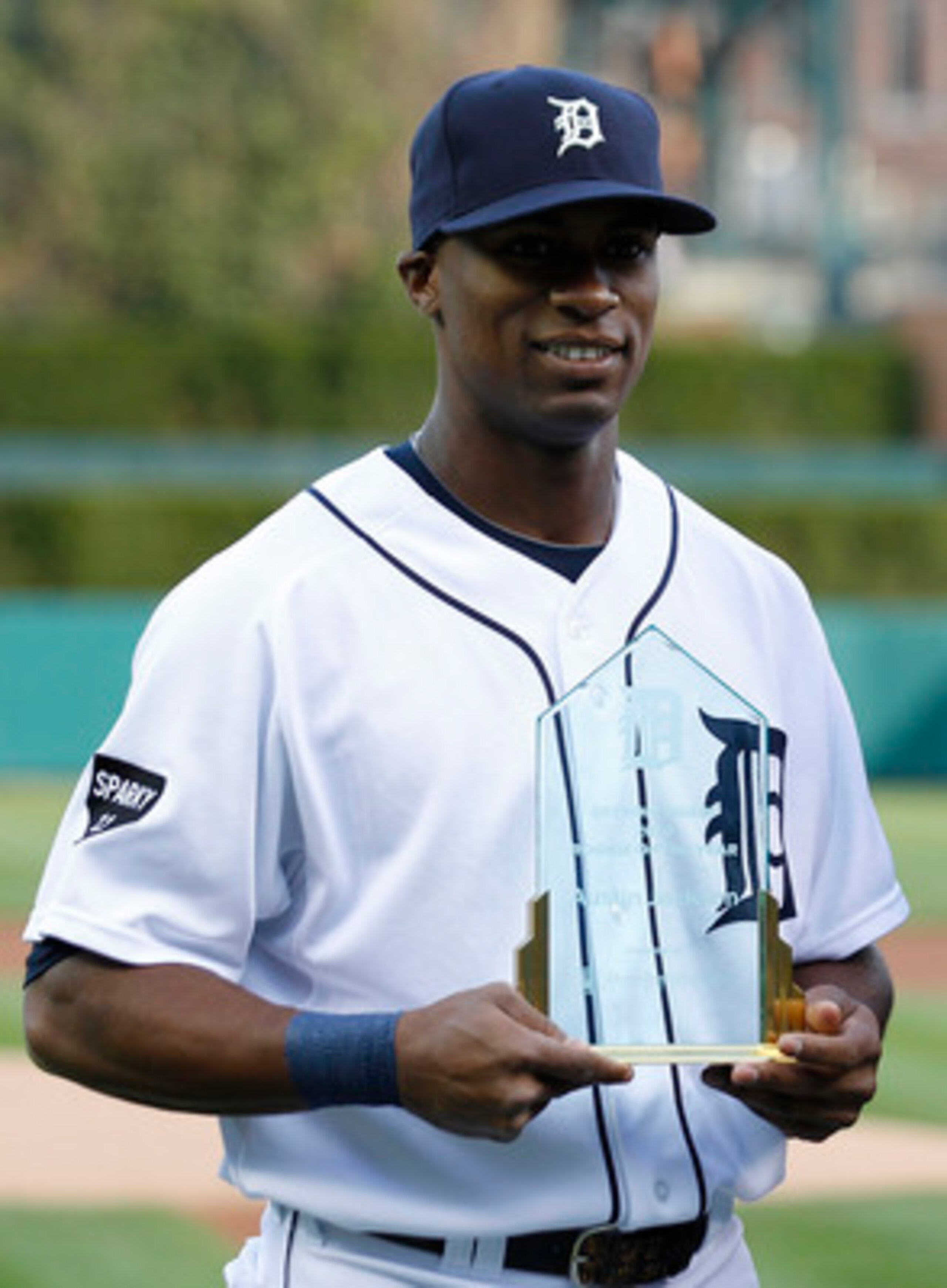 DETROIT - APRIL 26: Austin Jackson #14 of the Detroit Tigers receives the team's Rookie of The Year award prior to the start of the game against the Seattle Mariners at Comerica Park on April 26, 2011 in Detroit, Michigan. The Mariners defeated the Tigers