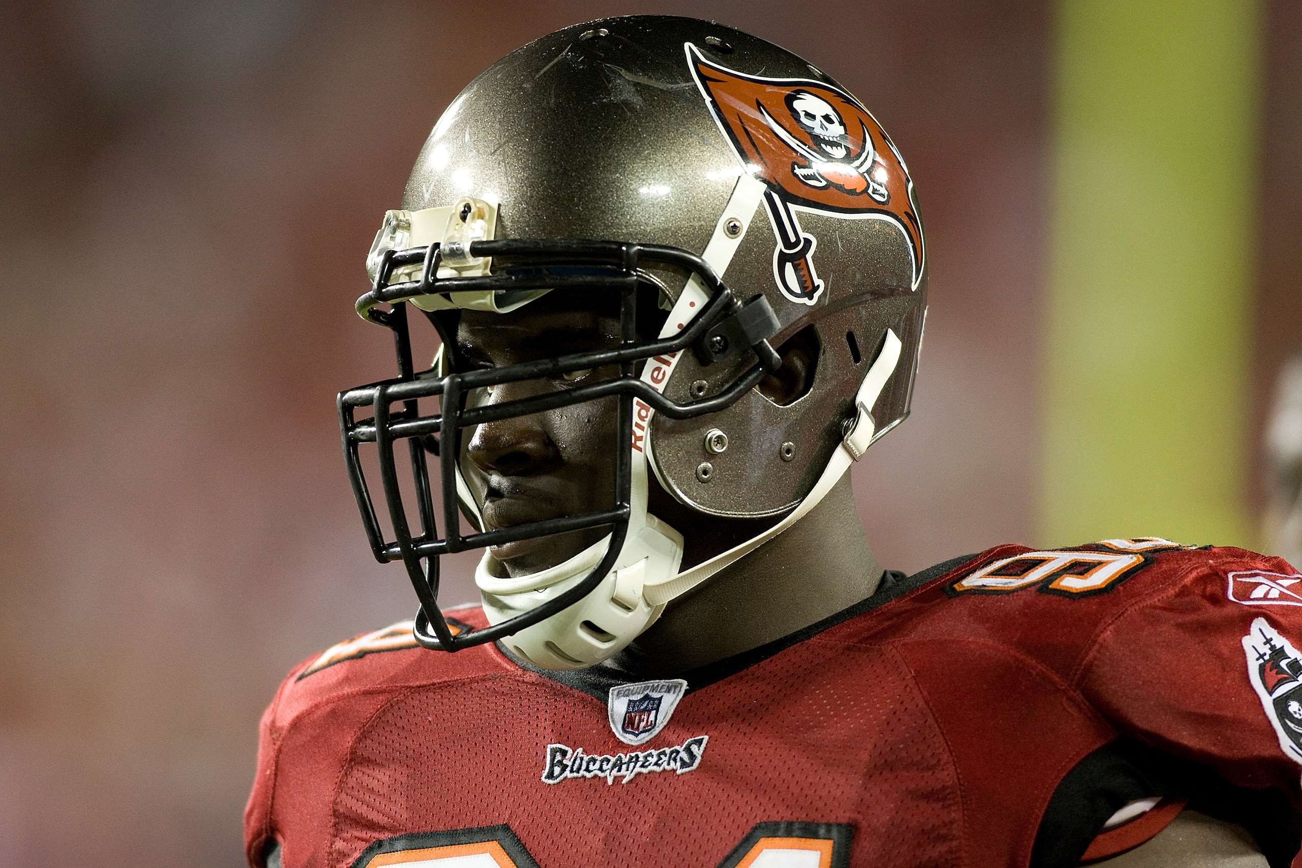 TAMPA, FL - SEPTEMBER 04:  Defensive tackle Kyle Moore #94 of the Tampa Bay Buccaneers watches his team from the bench against the Houston Texans during a preseason game at Raymond James Stadium on September 4, 2009 in Tampa, Florida.  (Photo by J. Meric/