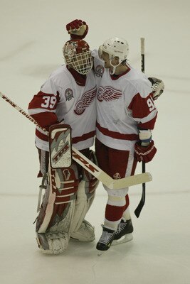 DETROIT, MI - JUNE 13:  Goaltender Dominik Hasek #39 of the Detroit Red Wings is congratulated by center Sergei Fedorov #91 during game five of the NHL Stanley Cup Finals against the Carolina Hurricanes on June 13, 2002 at the Joe Louis Arena in Detroit, 