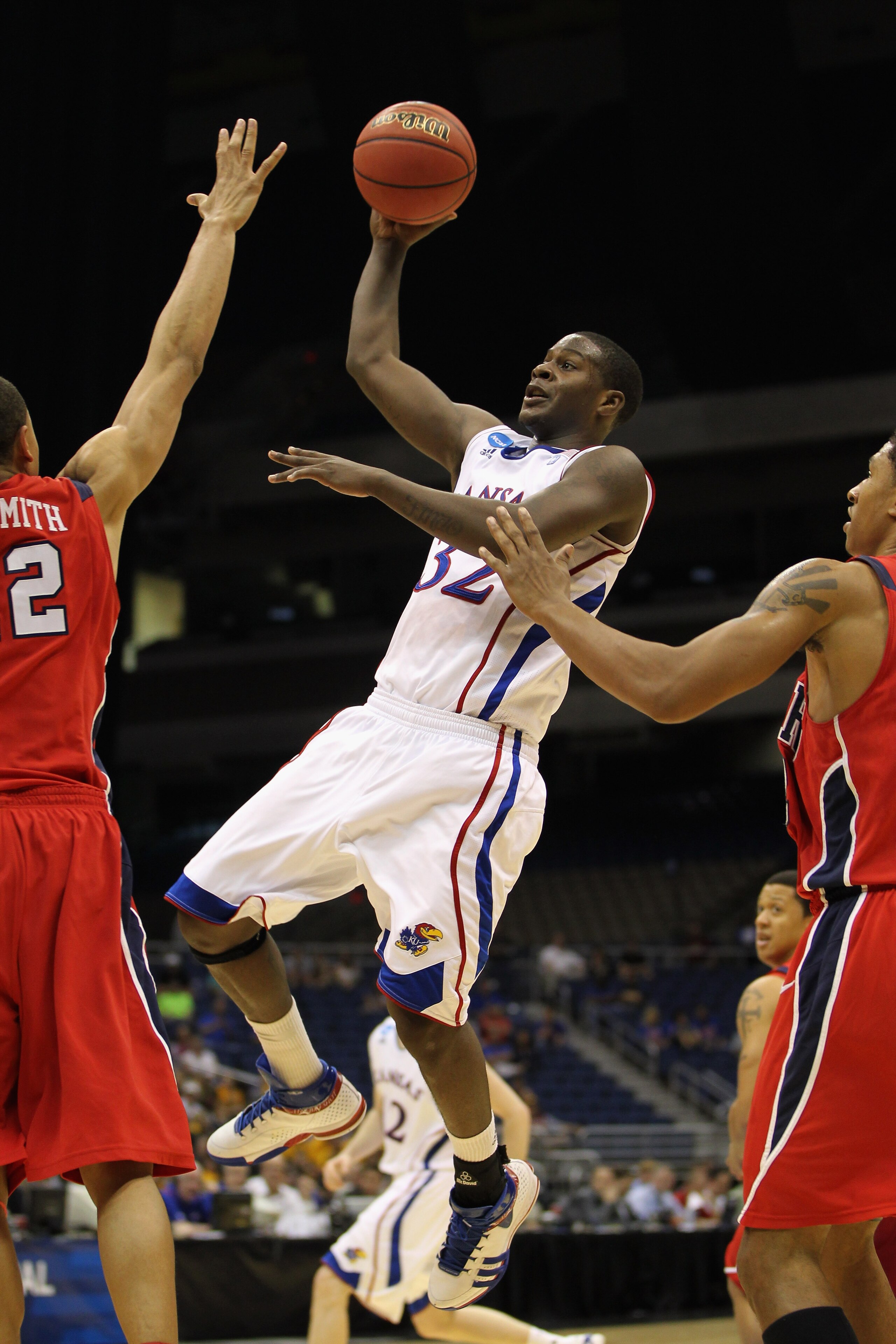 SAN ANTONIO, TX - MARCH 25: Josh Selby #32 of the Kansas Jayhawks puts up a shot against the Richmond Spiders during the southwest regional of the 2011 NCAA men's basketball tournament at the Alamodome on March 25, 2011 in San Antonio, Texas. (Photo by SAN ANTONIO, TX - MARCH 25: Josh Selby #32 of the Kansas Jayhawks puts up a shot against the Richmond Spiders during the southwest regional of the 2011 NCAA men's basketball tournament at the Alamodome on March 25, 2011 in San Antonio, Texas. (Photo by